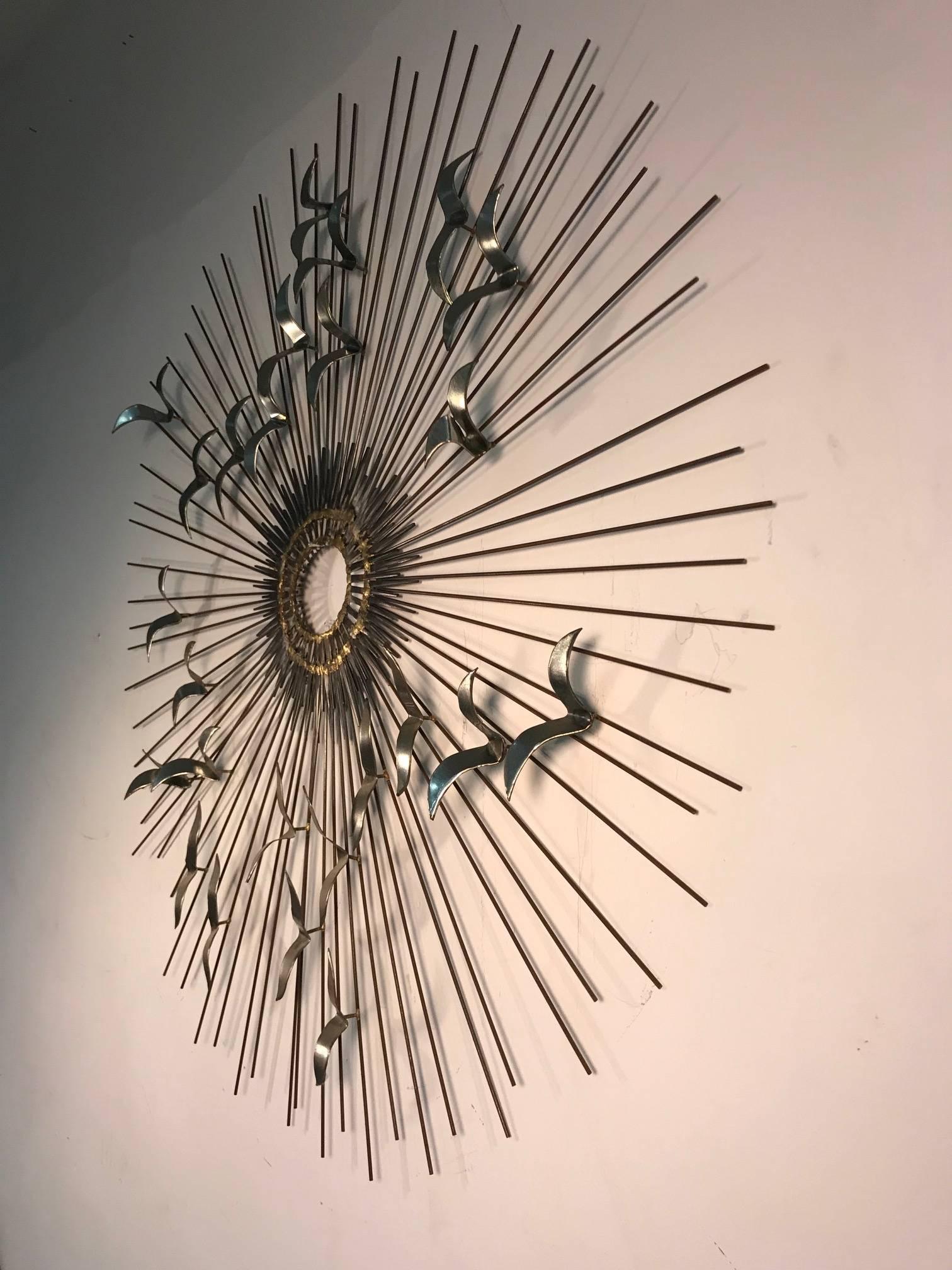 Sunburst with birds wall sculpture by Curtis Jere silver finish, 1970s.