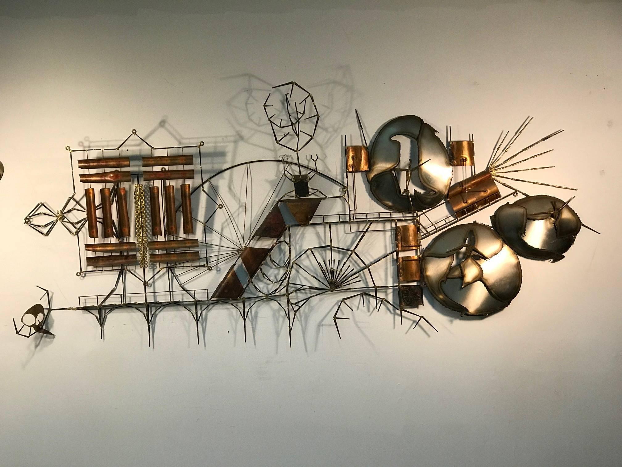 Monumental Wall Sculpture done in Mixed Metals with an abstract city sky line made of Nails, brass, iron and copper.