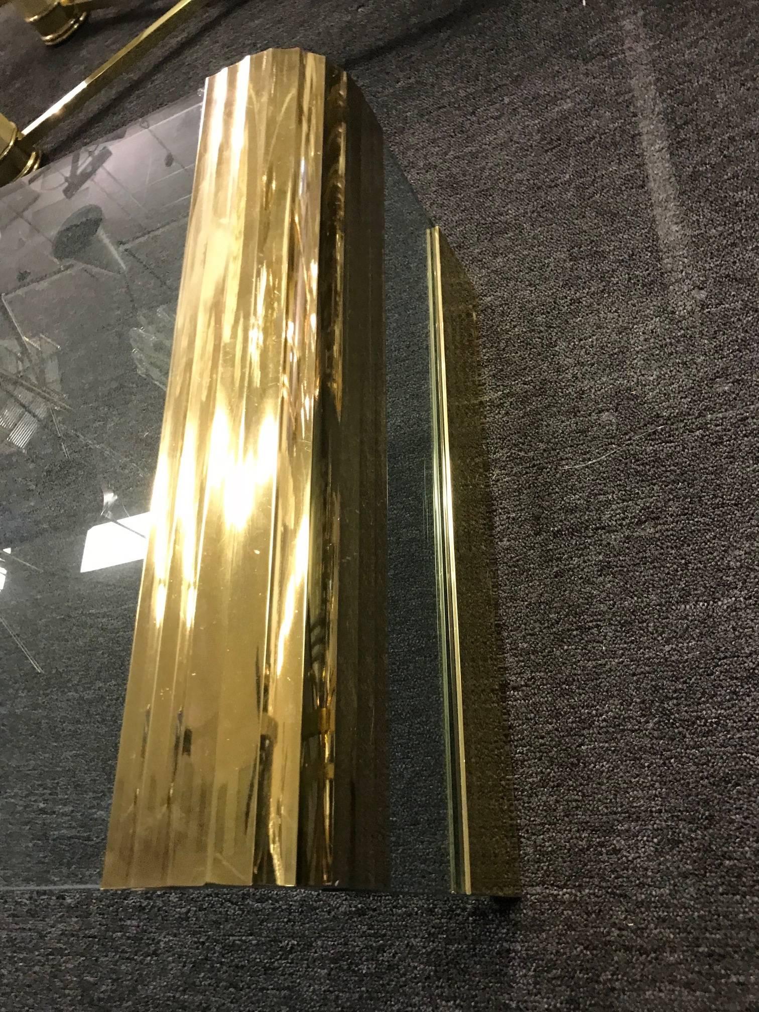 Coffee table by Pace Collection waterfall design made of glass and brass.