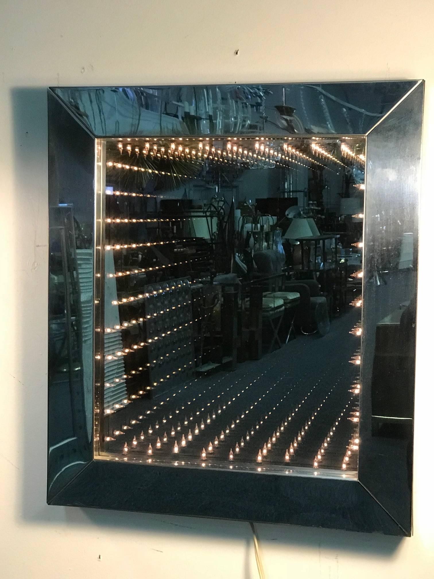  Original and Period Fantastic Rectangular Chrome and Glass Infinity Mirror With Substantial Chrome Frame Fitted with Interior light bulbs That Create An Optical Illusion when illuminated. Designed in The 1970's.