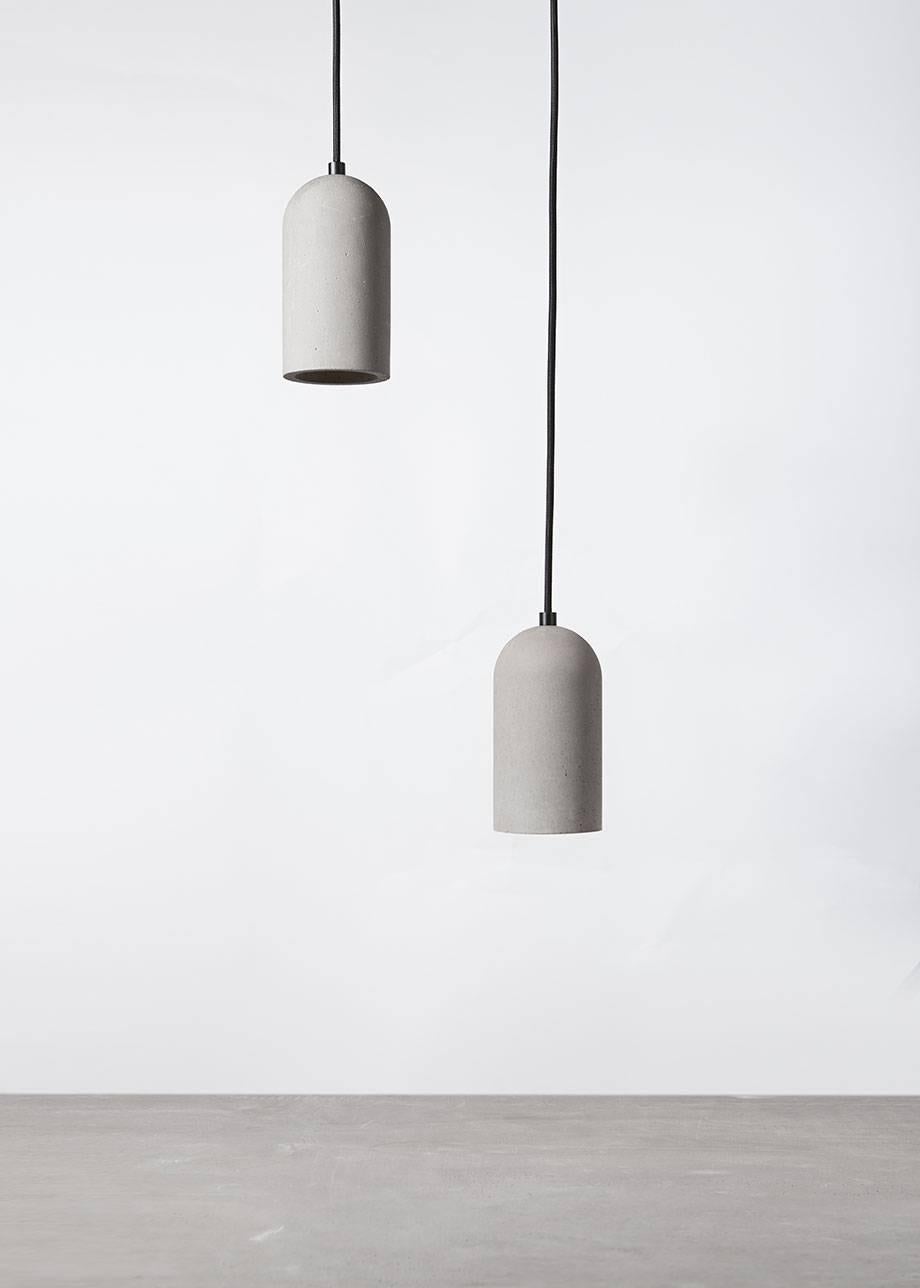 Concrete ceiling lamp designed by Cantonese studio Bentu Design.

(Sold individually)

18 cm High; 9,6 cm Diameter
Wire: 2Meters Black, Red, Yellow or Blue (adjustable)
Lamp Type: E27 LED 3W 100-240V 80Ra 200LM 2700K (compatible with US electric