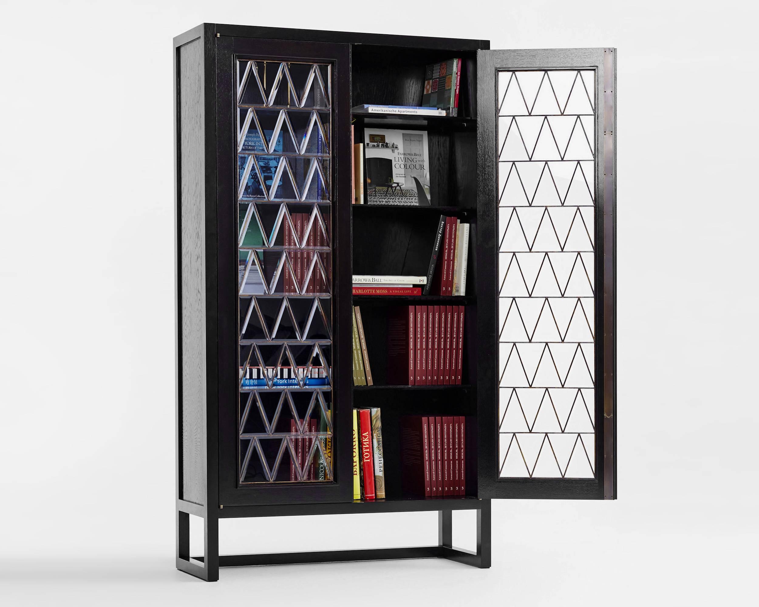 Bookcase by Russian designer Dmitry Samygin

Oak, stain glass and brass
Measures: 190 cm x 106 cm x 39 cm

After studying Applied Arts at the National University of Art and Industry, Stroganov, Dmitry Samigyn quickly collaborated with his