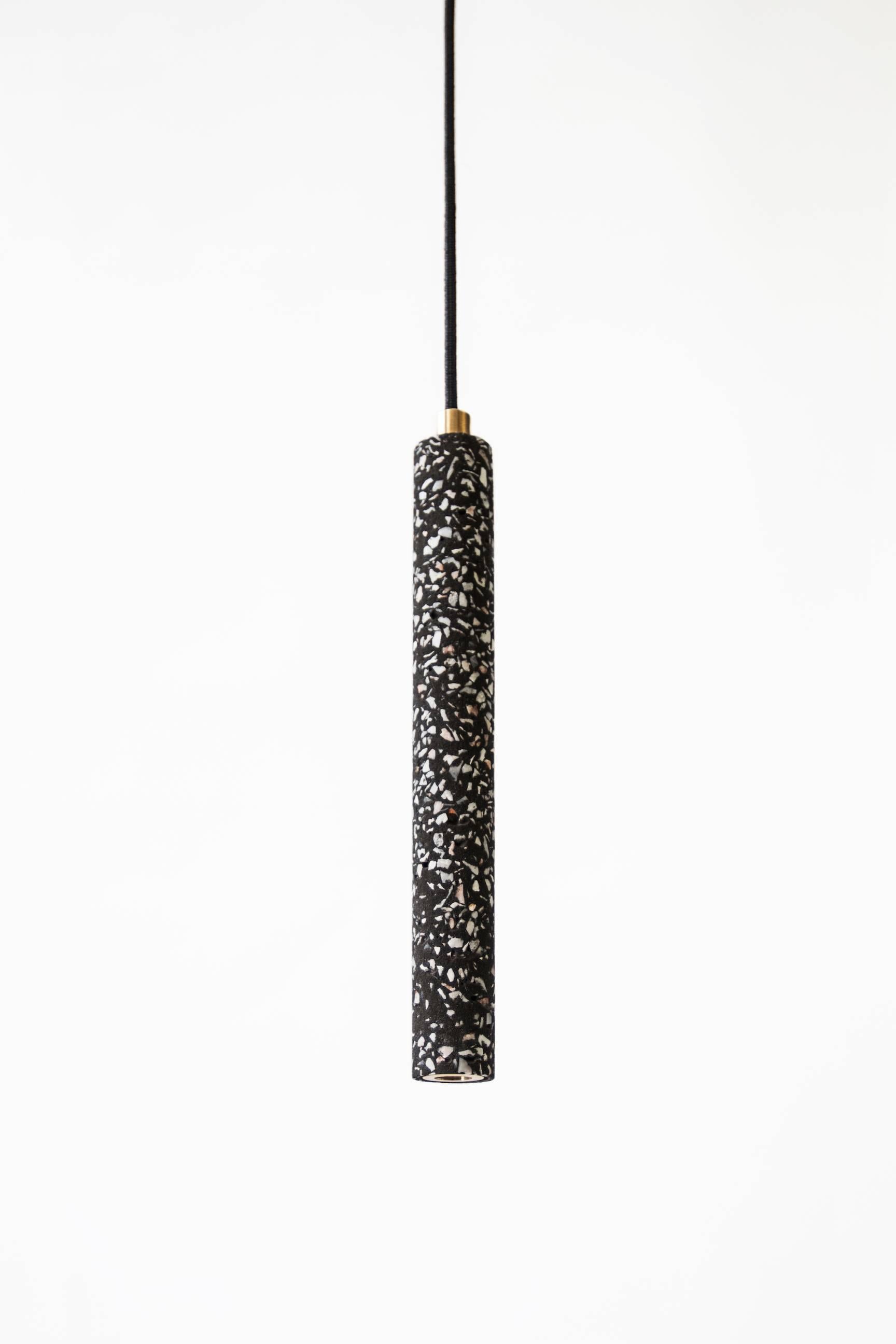 Black terrazzo and concrete ceiling lamp designed by Cantonese studio Bentu Design.

(Sold individually)

Measure: 31 cm high; 4.5 cm diameter
Wire: 2 meters black (adjustable)
Lamp type: G9 LED 1,5W

Black finish only.
 
 
“Bang” ceiling lamps are