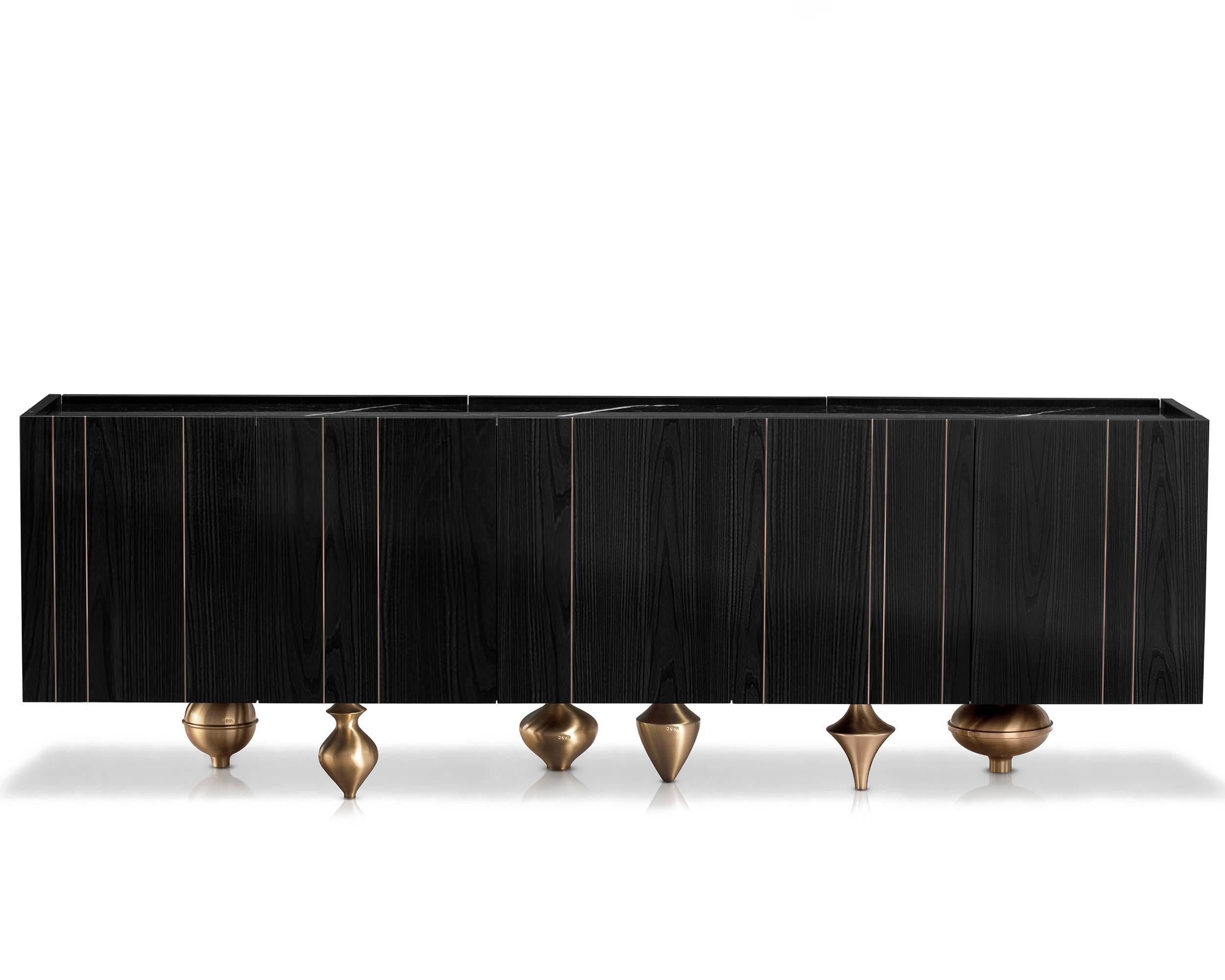 An alternation of rounded shapes and geometrical lines, reassuming discipline and freedom, a composite, multiethnic plan in which each component and each material contributes to the harmonious balance of the piece.  Il Pezzo 1 Black Credenza is