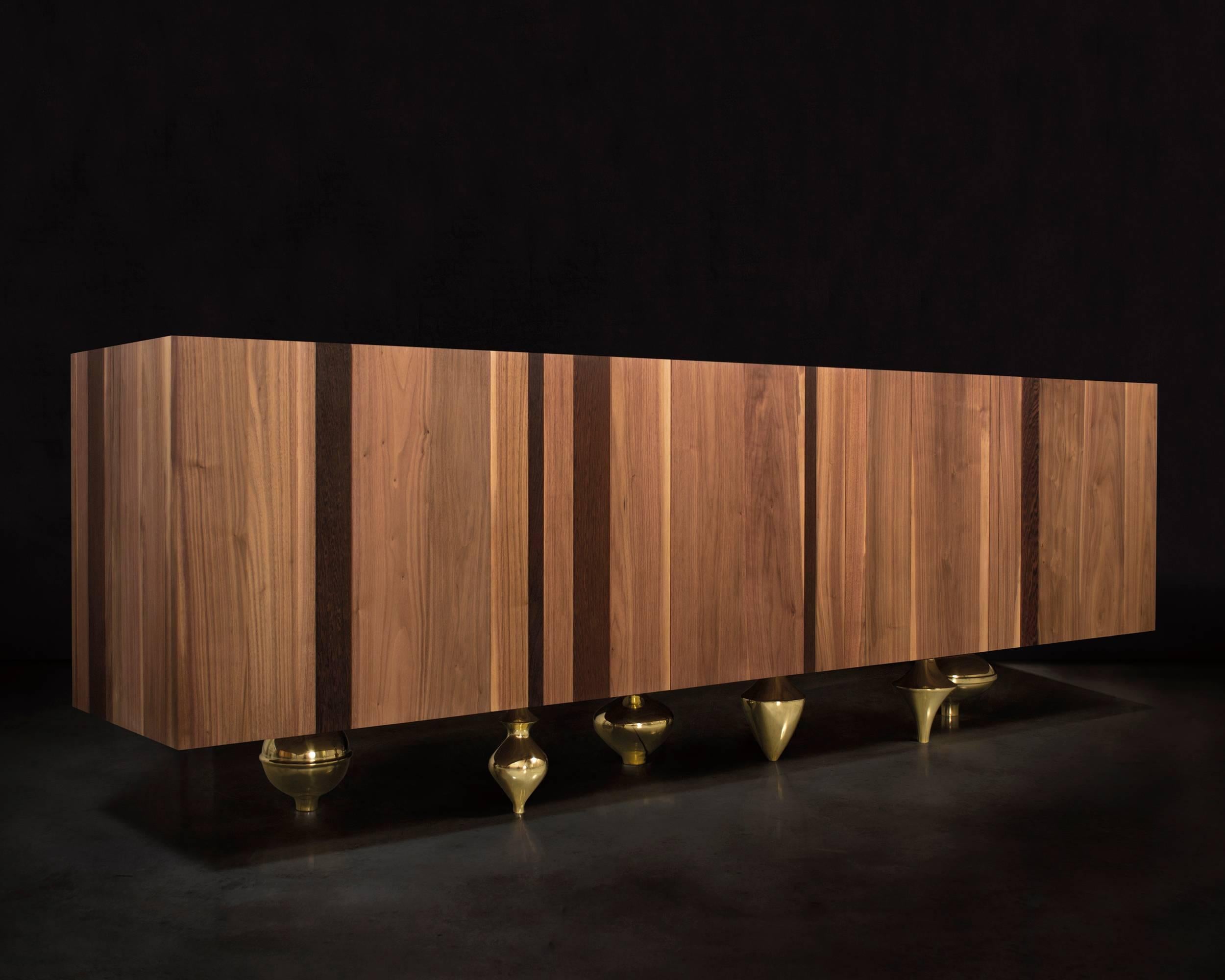 An alternation of rounded shapes and geometrical lines, reassuming discipline and freedom, a composite, multiethnic plan in which each component and each material contributes to the harmonious balance of the piece.  Il Pezzo 1 Credenza is completely