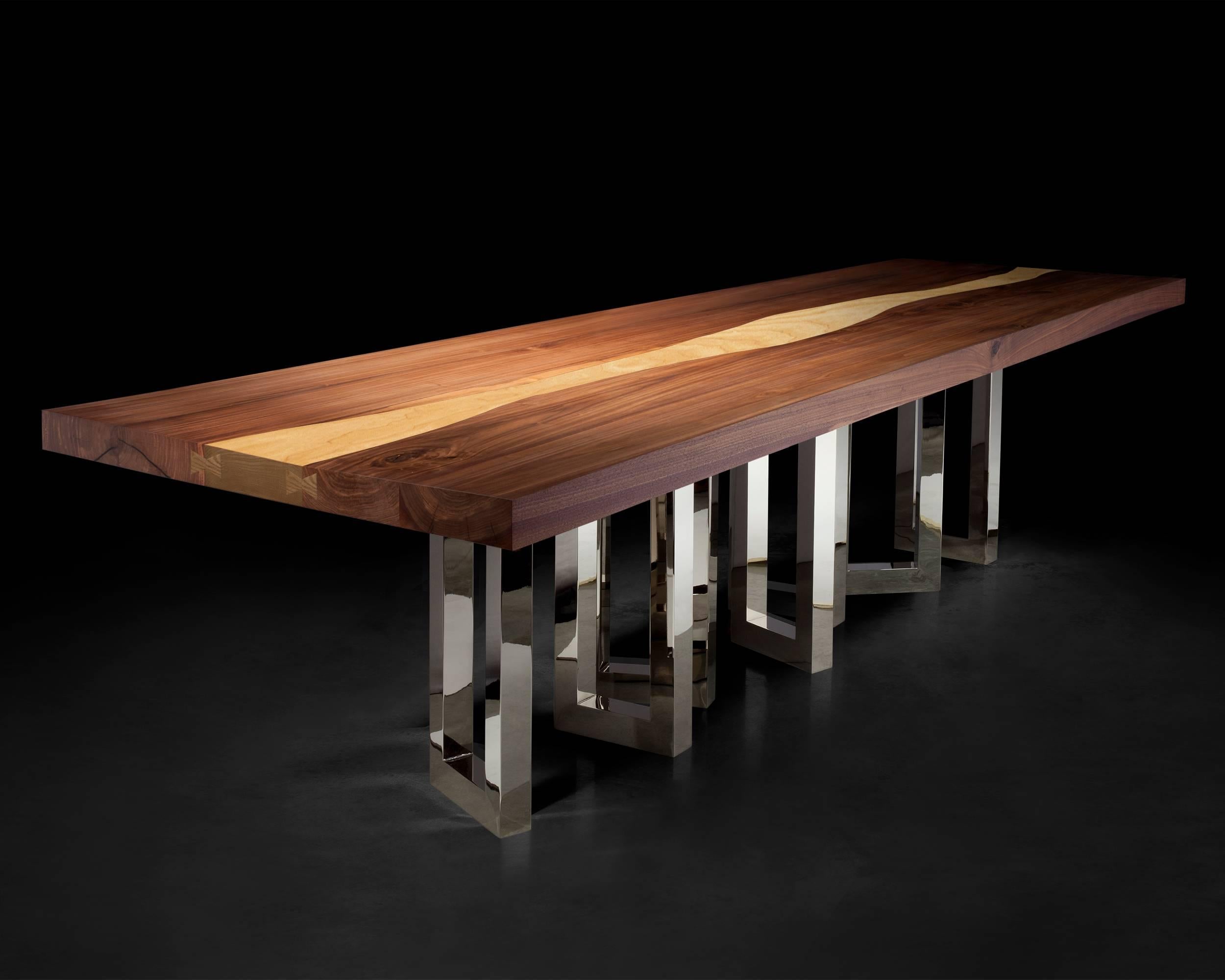 A solid block of walnut held up by what seems to be a casually arranged group of glittering legs. A composite of contrasting elements, massive and sophisticated, strong and passionate; Il Pezzo 6 Table is a harmonious and timeless whole.
The