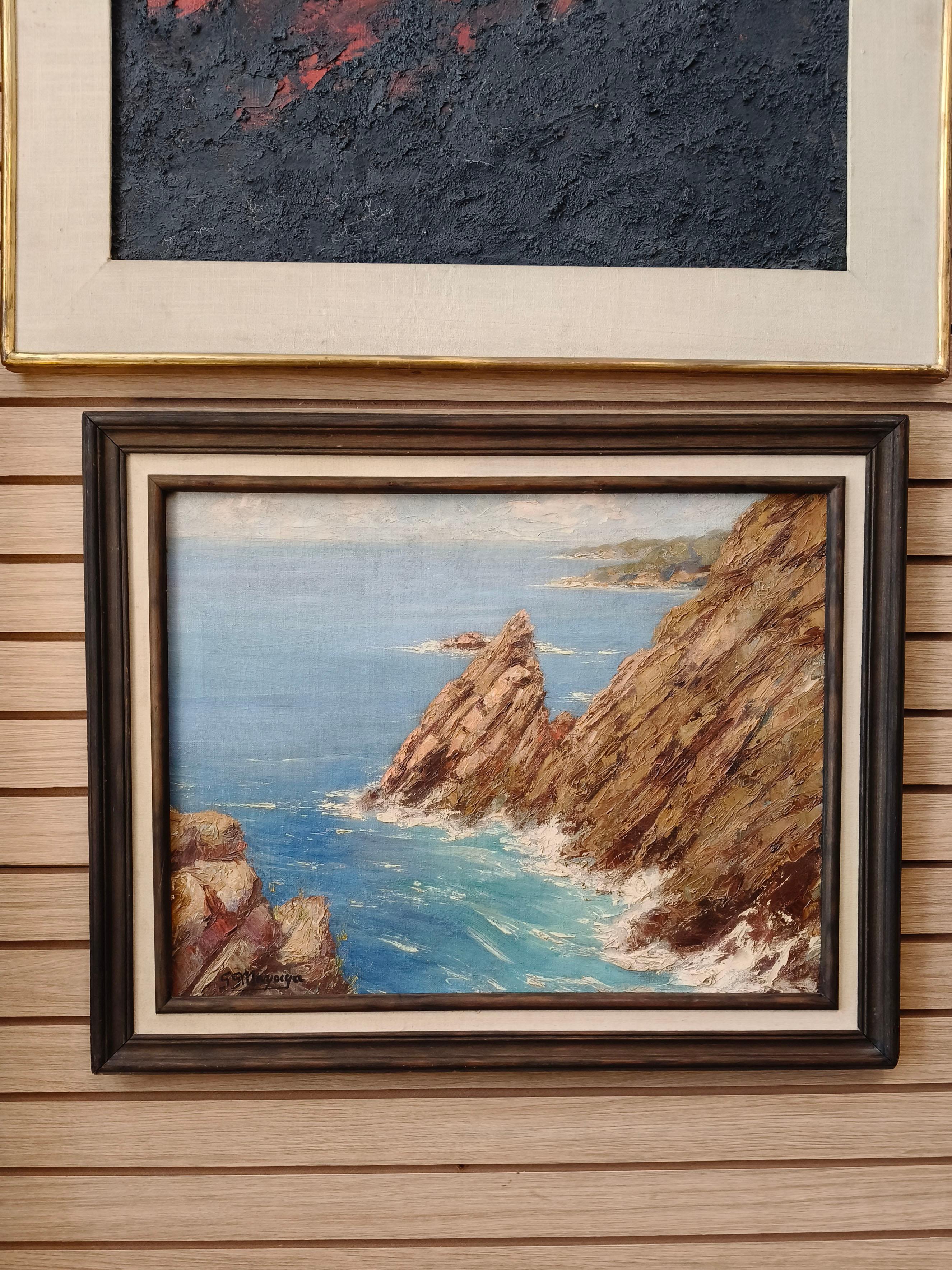 Ein Ölgemälde auf Leinwand aus den 1950er Jahren des mexikanischen Künstlers Guillermo Gómez Mayorga. Das Gemälde zeigt eine Ansicht der Klippe La Quebrada in Acapulco, Mexiko. Das Gemälde ist auf der Vorderseite signiert und hat auf der Rückseite