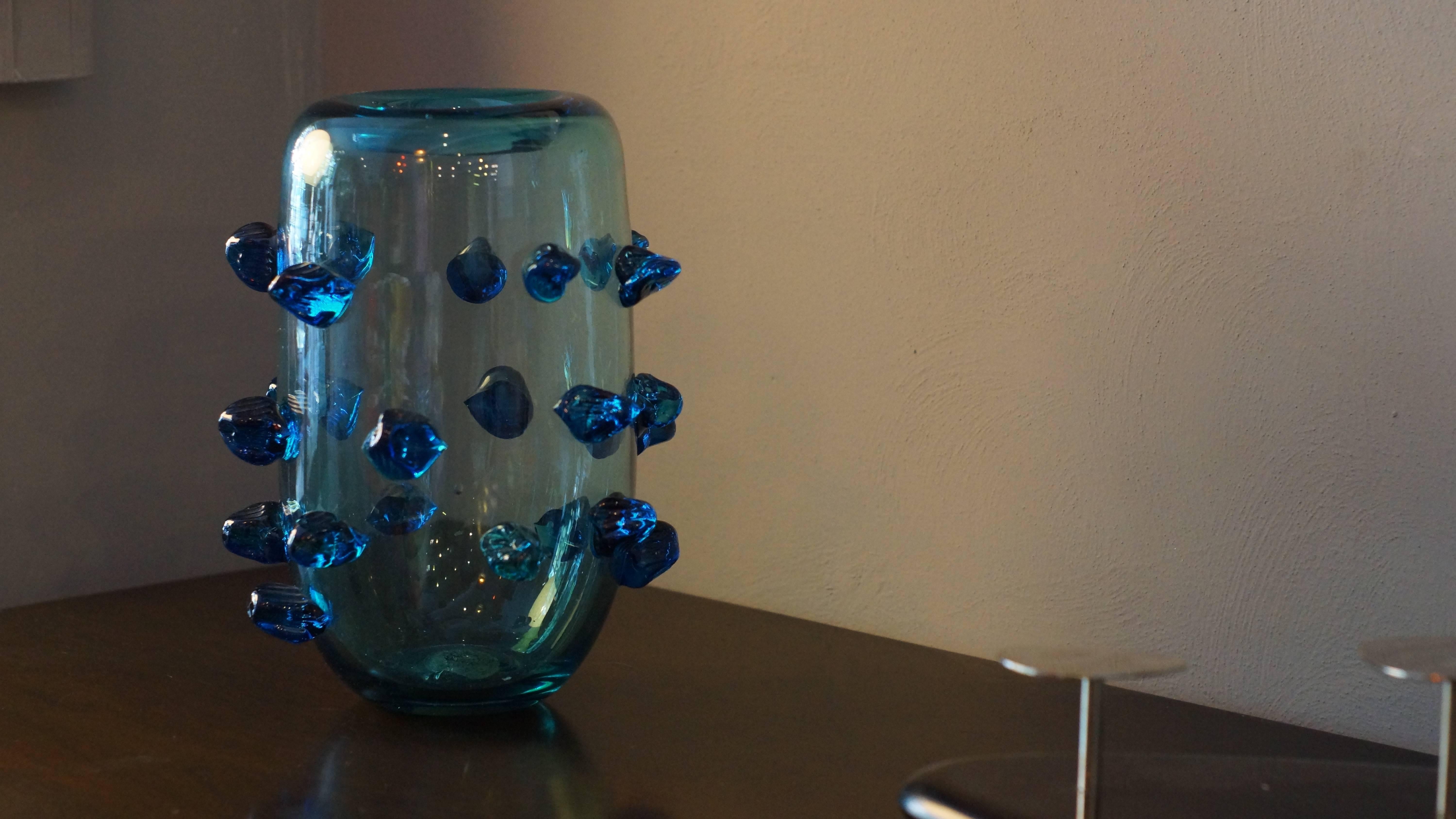 Blue Murano vase, the overlay is decorated with Murano glass in irregular shapes.