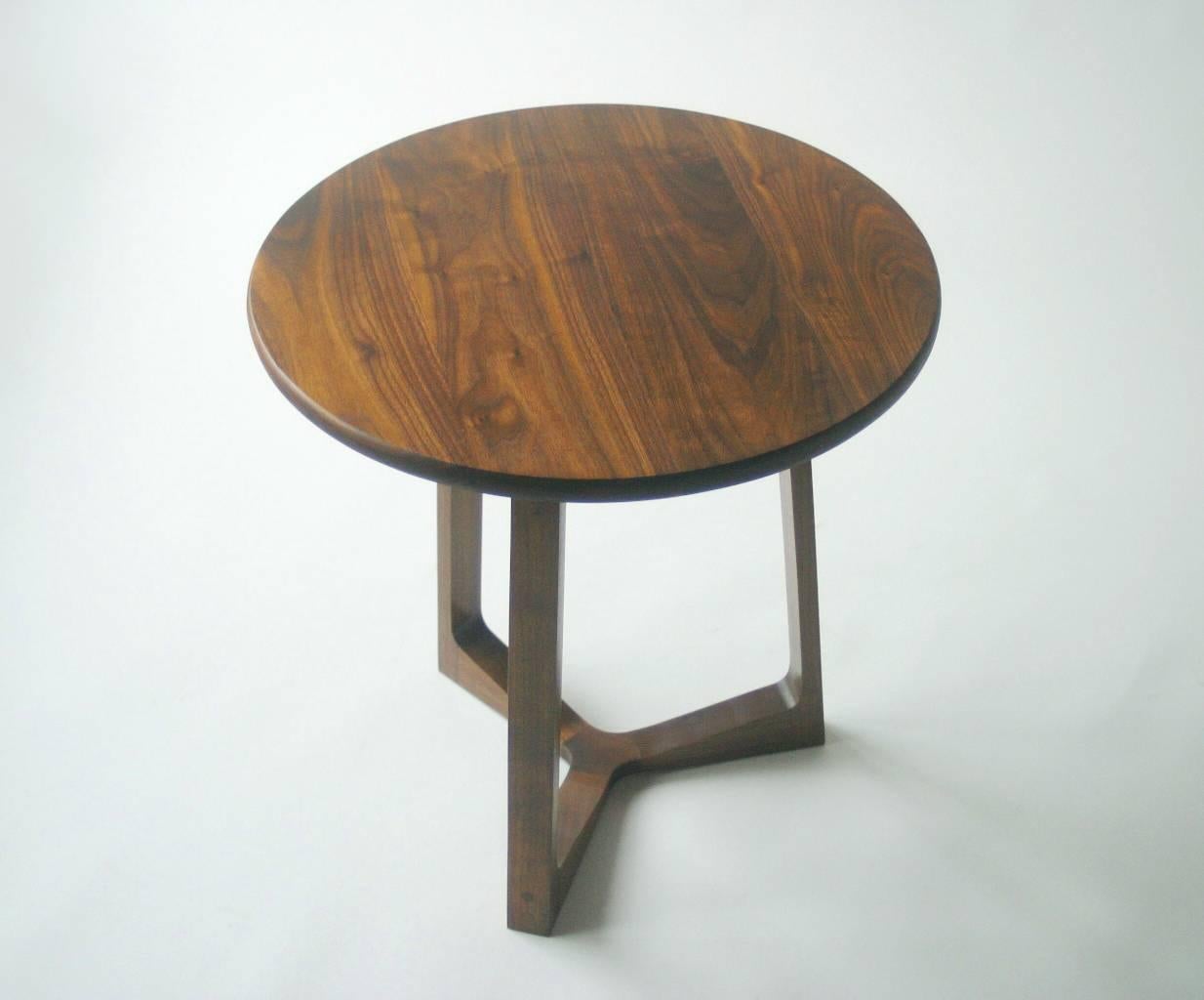 This table represents the simplest kind of modern, with clean lines, an elegantly sculpted base, and enduring hardwood construction. Crafted of solid walnut with exposed joinery and a hand rubbed oil finish, the wood exhibits beautiful depth and