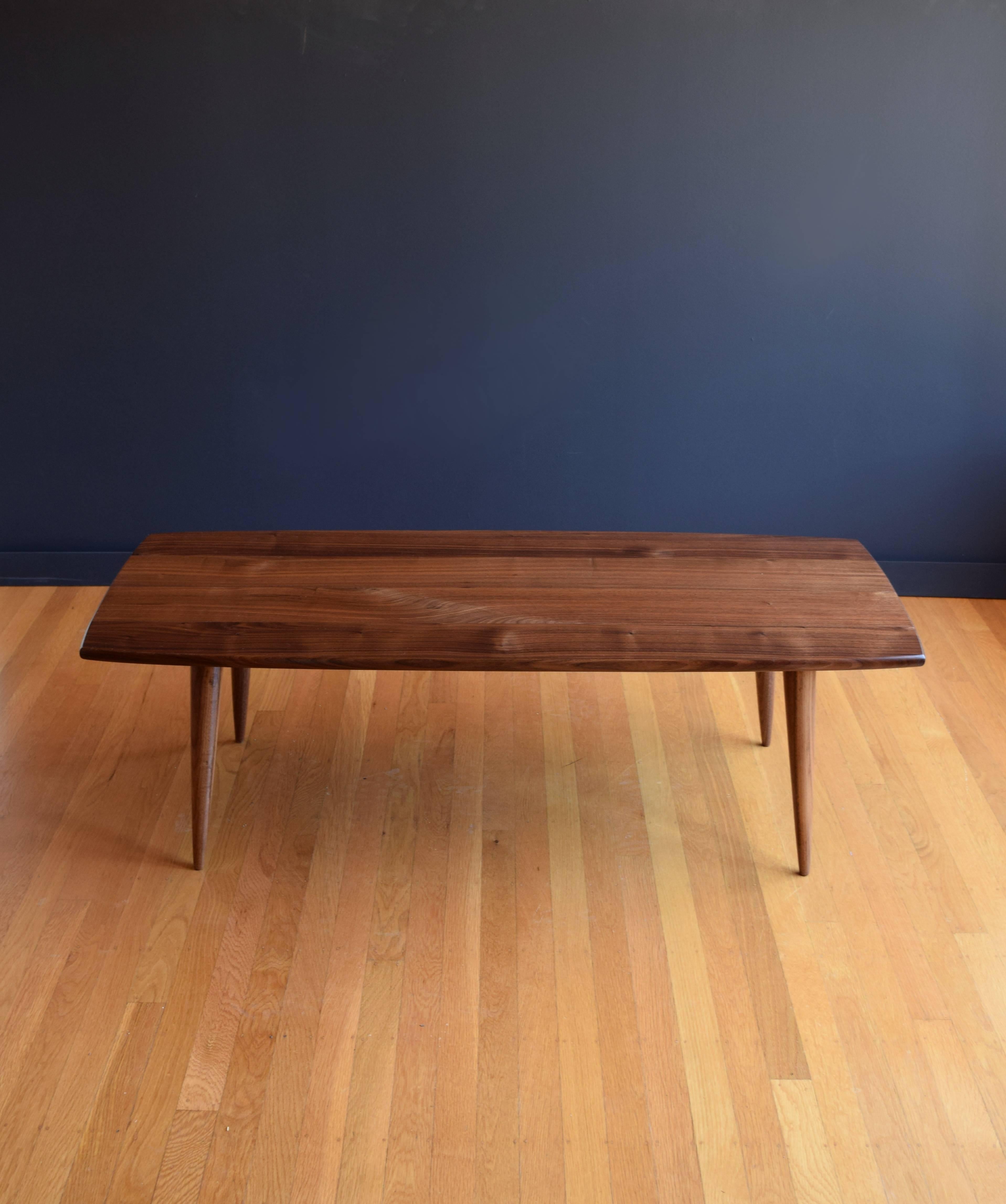 This table represents the simplest kind of modern, with clean lines, elegantly tapered legs, and enduring hardwood construction. Crafted of solid walnut with a hand rubbed oil finish, the wood exhibits beautiful depth and contrast of color with