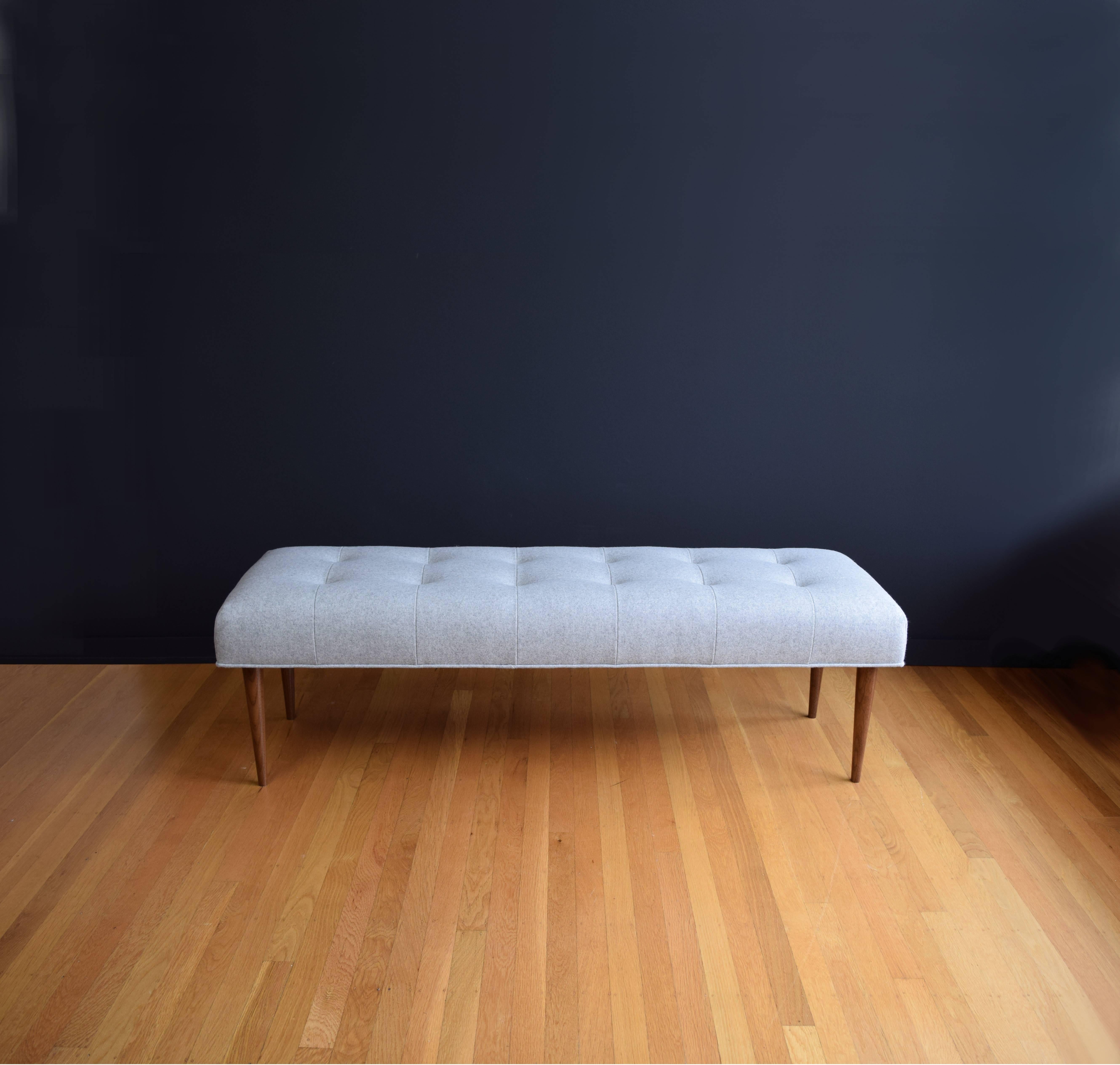 grey tufted bench
