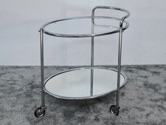 Carrito de bar ovalado de estilo Art Déco en cromo y cristal, Francia, década de 1930