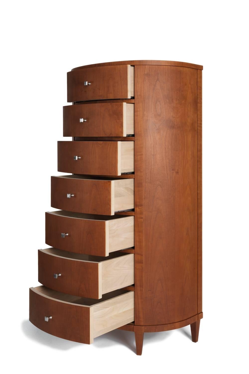 A chest of drawers in the Wellington style. Made using the bent wood technique, seven drawers carried on sliding rails, bookmatch veneered. Silver plated handles (knobs), inside sanded but untreated (not lacquered). Solid wood tapered feet. Stained