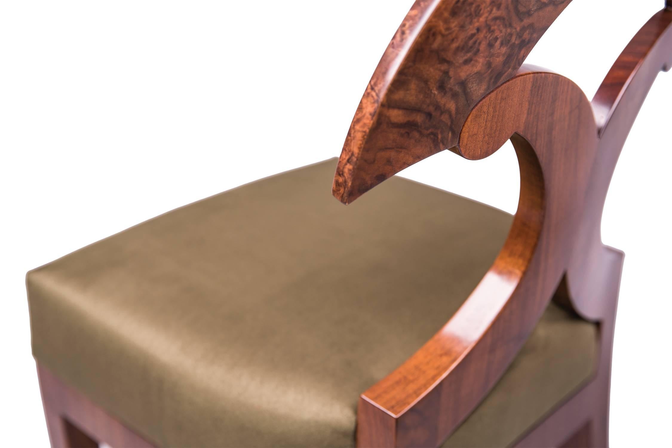 Burl Yoke back side chair with tapered front legs, lavishly curved back legs (curved in three dimensions), with glue-laminated veneered backrest (burl wood), back curved to fit the body, upholstered with a three-layer padding material on zig-zag