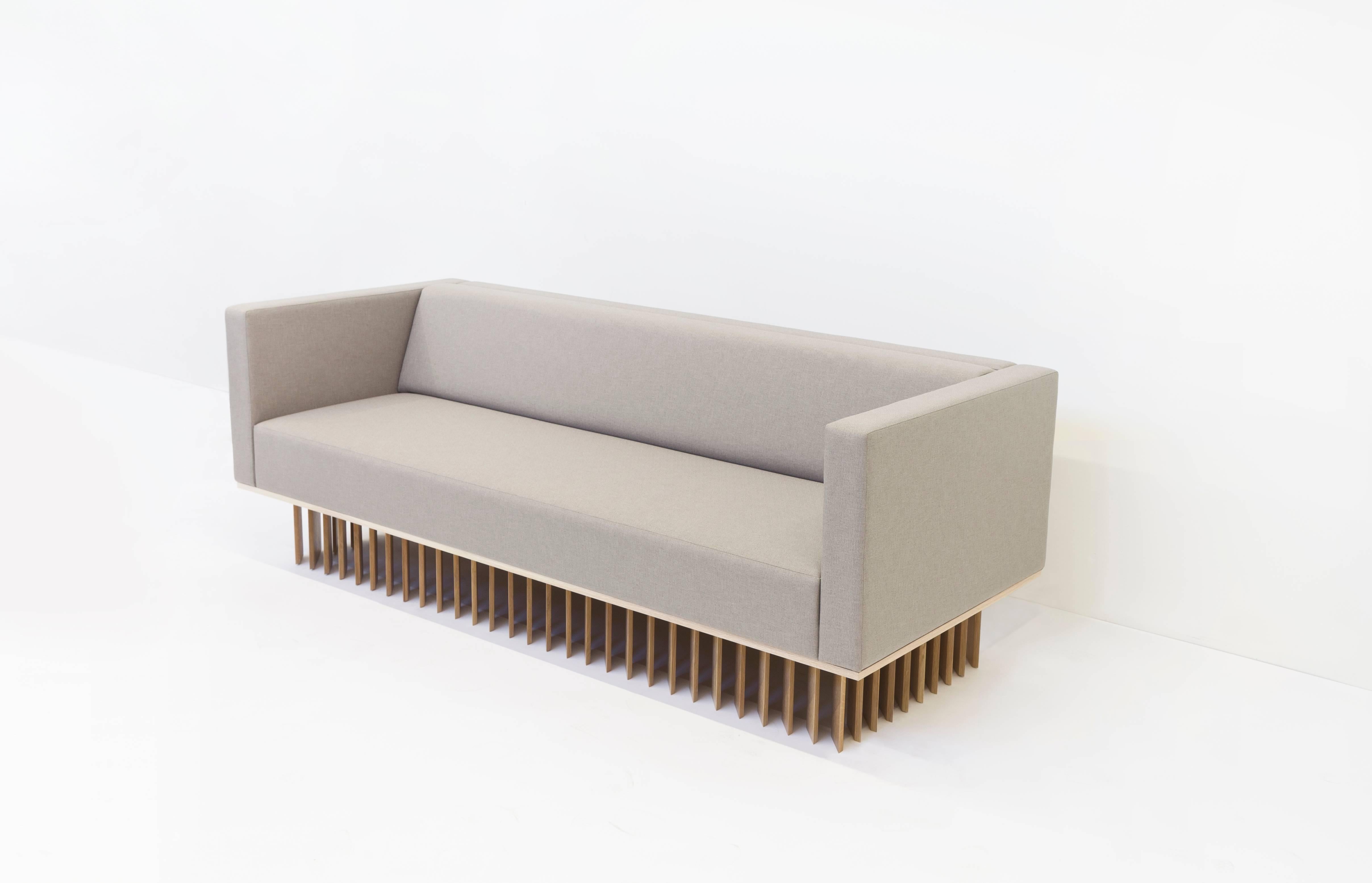 Not So General Gallery in Los Angeles is proud to present the Angled Wood Bar Sofa from design studio Early Wok. A modern masterpiece, the sofa is plushly upholstered in manner by Maharam, the seat cushion of the sofa sits atop a white oakwood