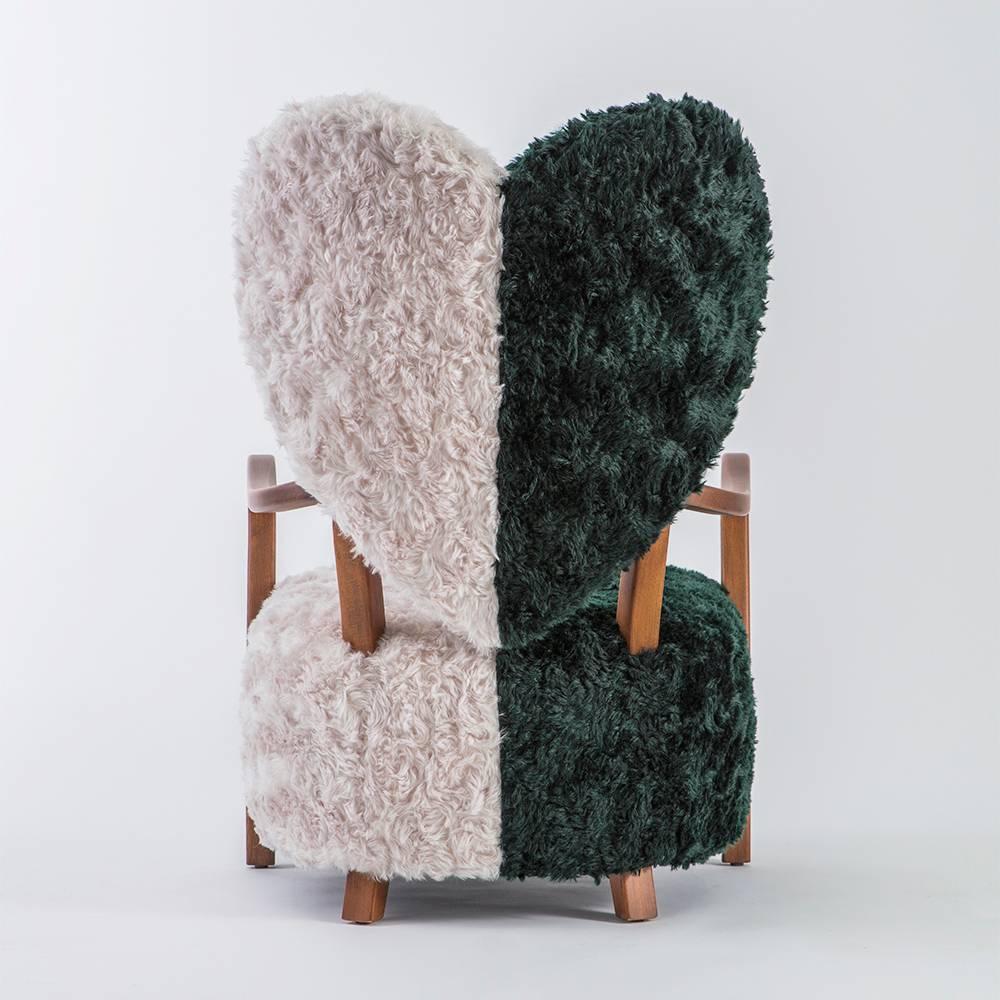 Dedicated to all the broken hearts, UNI chair from Istanbul-based designer Merve Kahraman represents both separation and unification of souls.

Contrasting of forest green and cream reflect the differences between any two living things and the