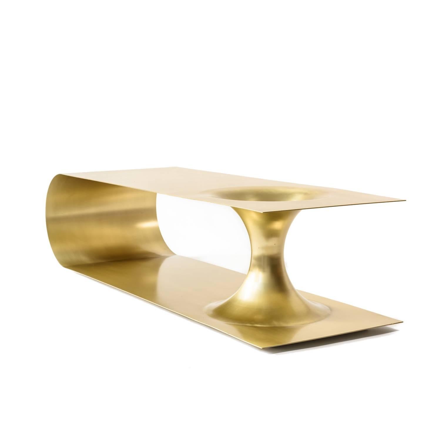 Not So General Gallery in Los Angeles is proud to present the Wormhole Coffee Table by Brooklyn-based Erickson Aesthetics which is constructed of brass-plated steel derives its name from the topological features that represent the shortcut between