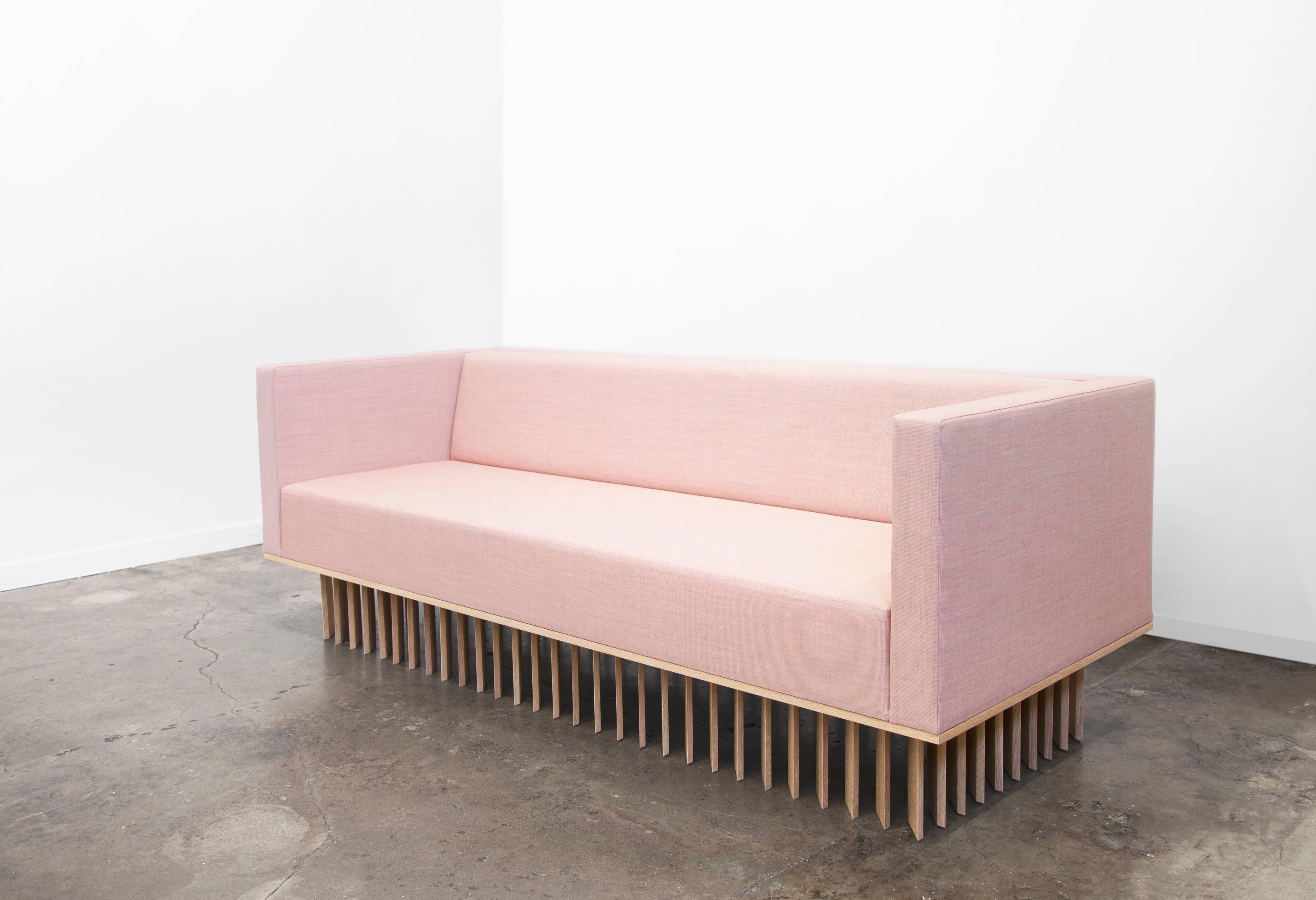 Not So General Gallery in Los Angeles is proud to present the Angled Wood Bar Sofa from design studio Early Work.  A modern masterpiece, the sofa is plushly upholstered in Manner by Maharam, the seat cushion of the sofa sits atop a white oakwood