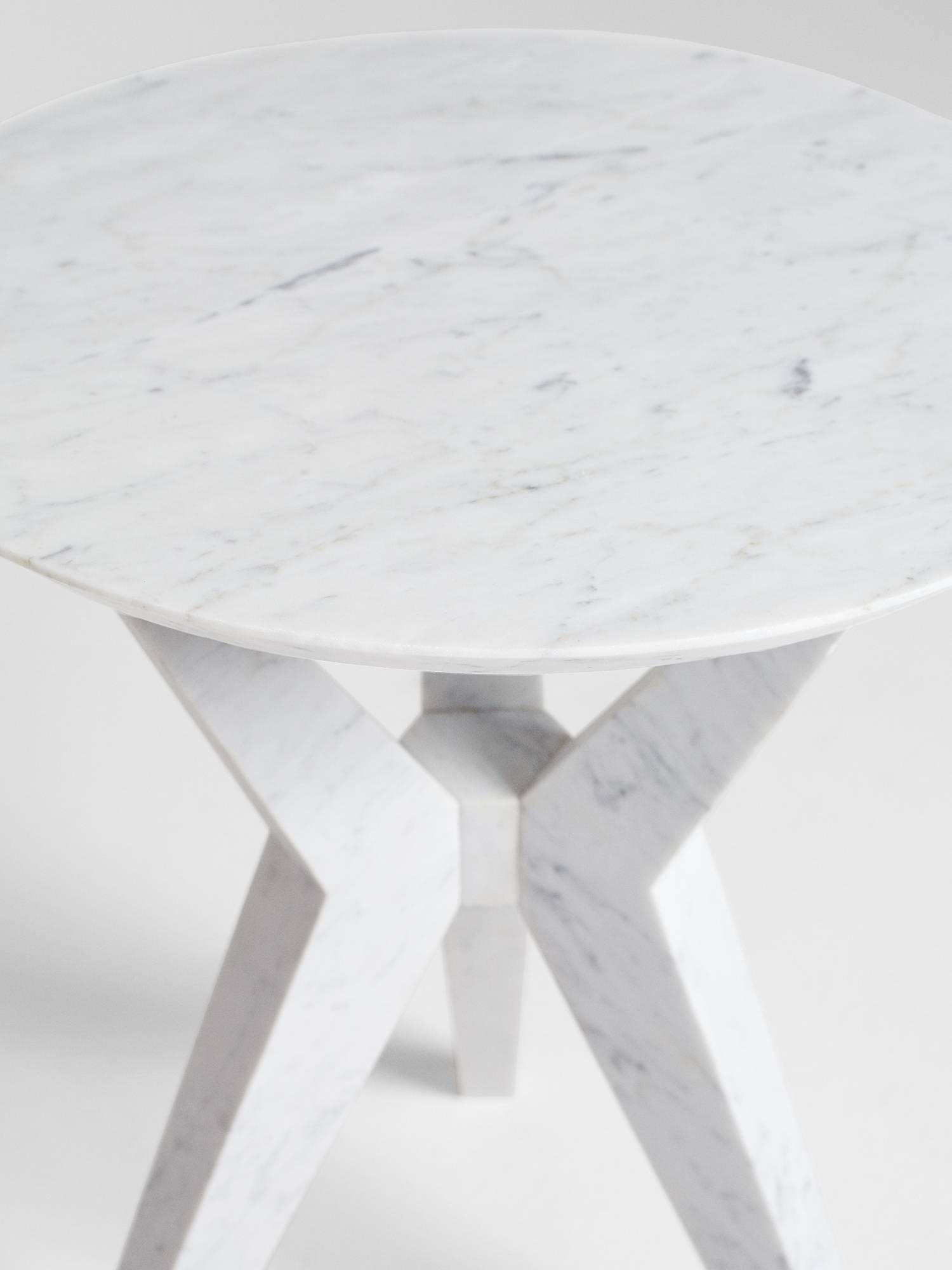 Hand-sculpted by Los-Angeles based master stone carver, Nathan Hunt, the Tripod Side Table is made entirely from Carrara marble.

Perfect as a side table the Tripod Table can also be used as an end table. As it is hand-carved by the designer /