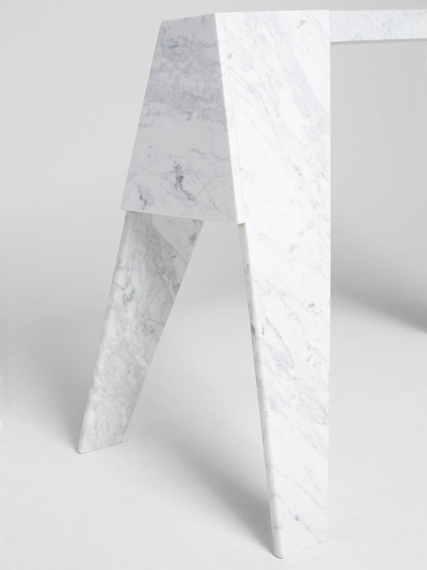 Hand-sculpted by Los-Angeles based master stone carver, Nathan Hunt, the workhorse console table is made entirely from Carrara marble and is a contemporary take on the classic Sawhorse / Workhorse table.

Perfect as a console table the workhorse