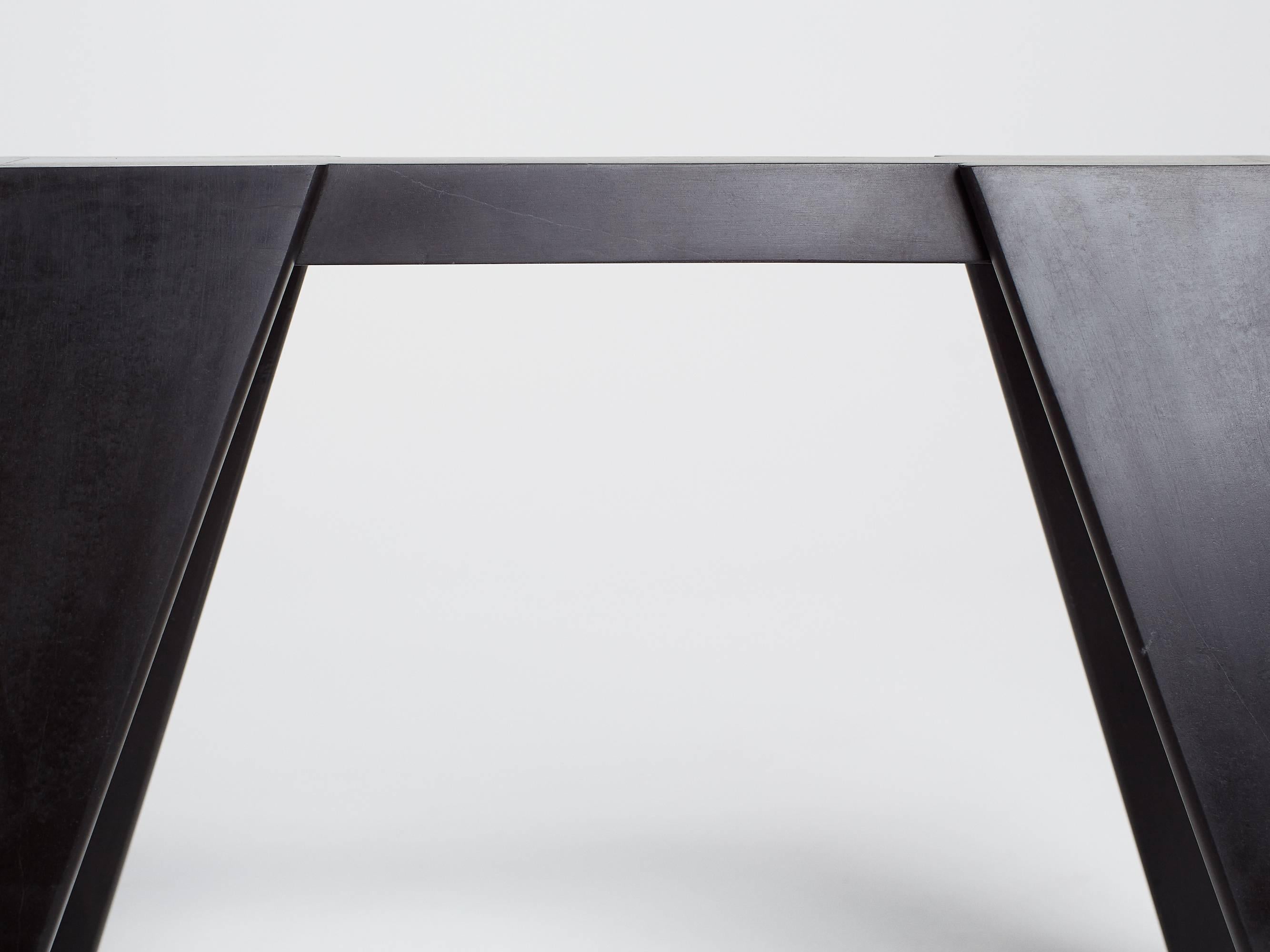 Hand sculpted by Los-Angeles based master stone carver, Nathan Hunt, the workhorse console table is made entirely from Nero Marquina marble and is a contemporary take on the classic sawhorse or workhorse table.

Perfect as a console table the