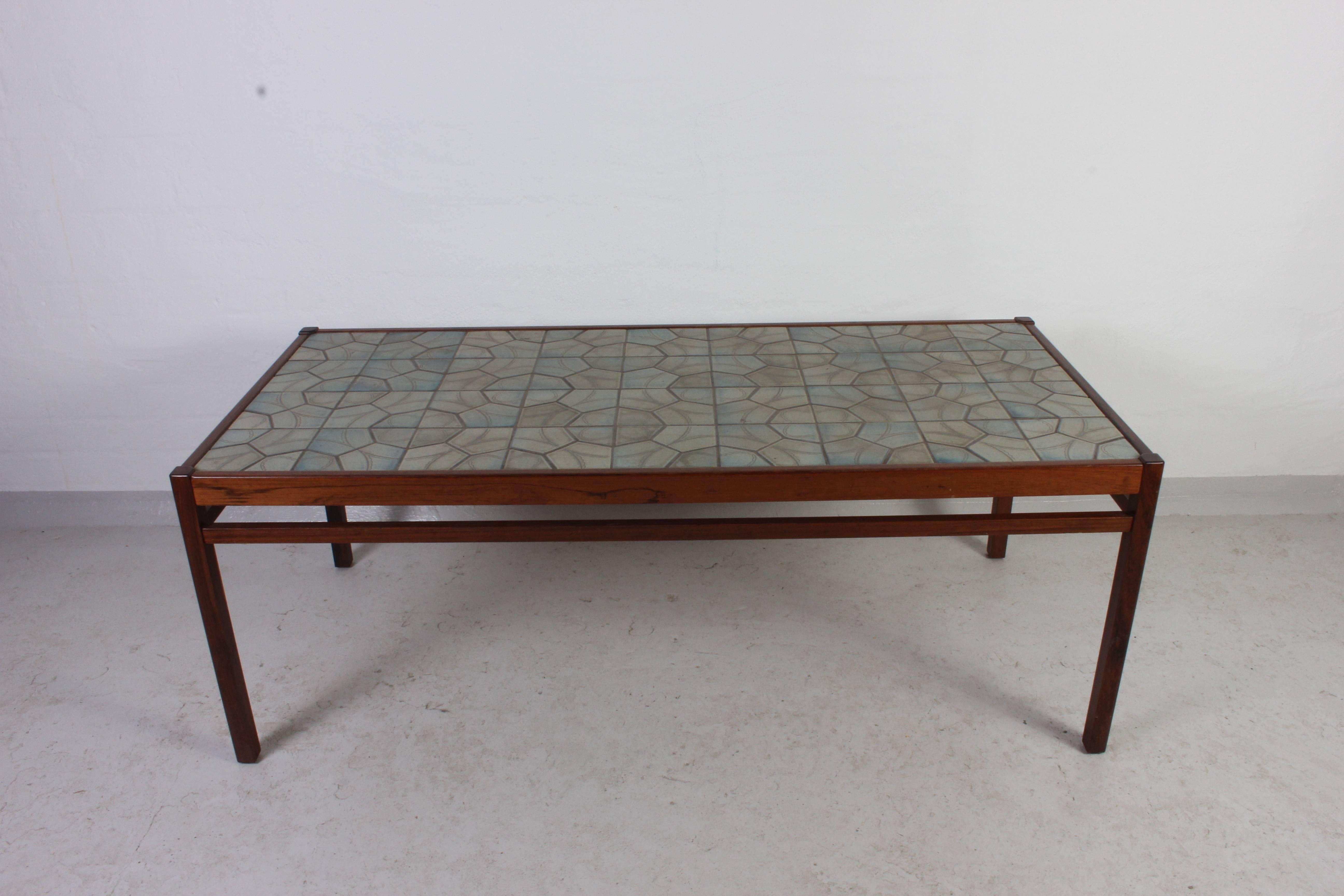 Midcentury Danish coffee table with ceramic tile top. This table is in very good vintage condition.