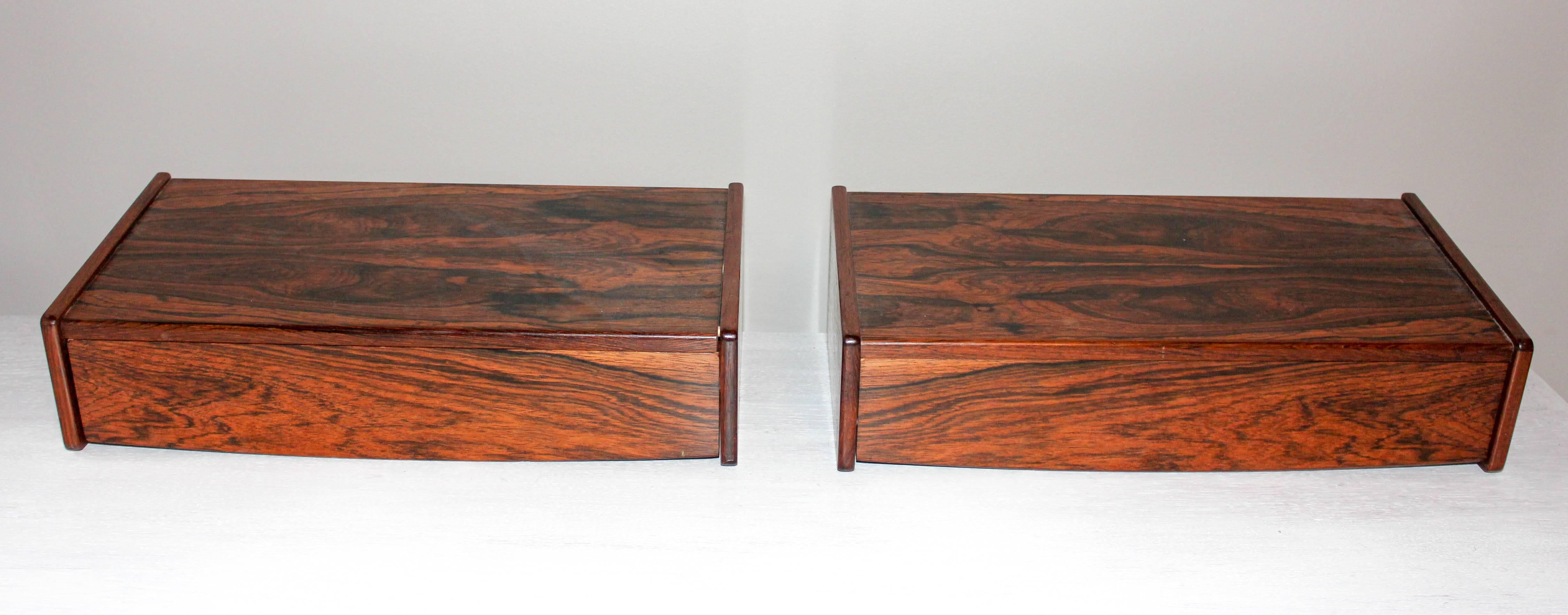 This pair of rosewood nightstands are made by unknown design designer and are made for bedroom interior. These high quality pieces in minimalistic design are mounted directly on the wall. The rosewood has very nice grain and both stands are in very