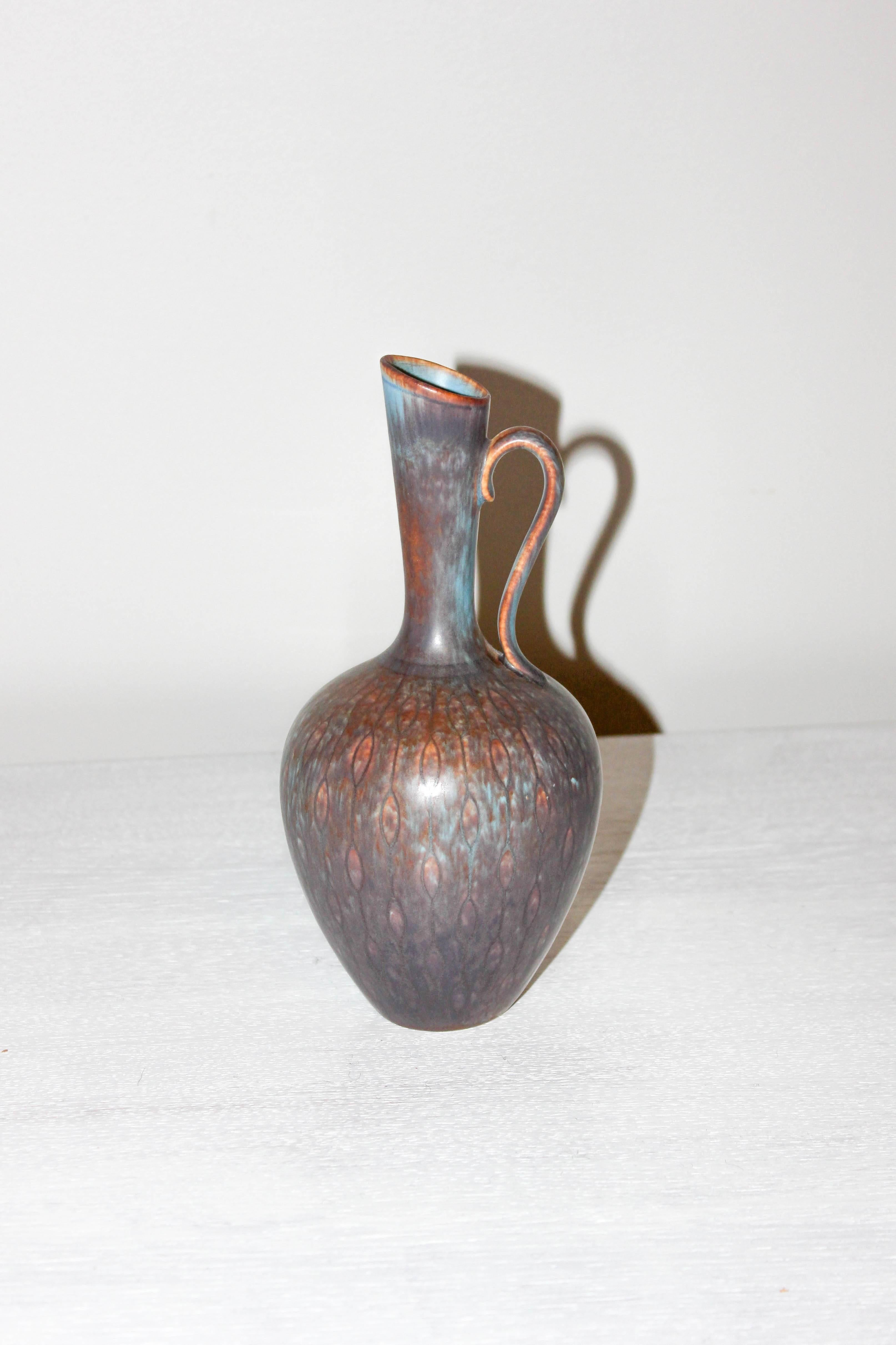Very decorative midcentury ceramic vase by Swedish designer Gunnar Nylund for Rörstrand. The vase is in very good vintage condition.
