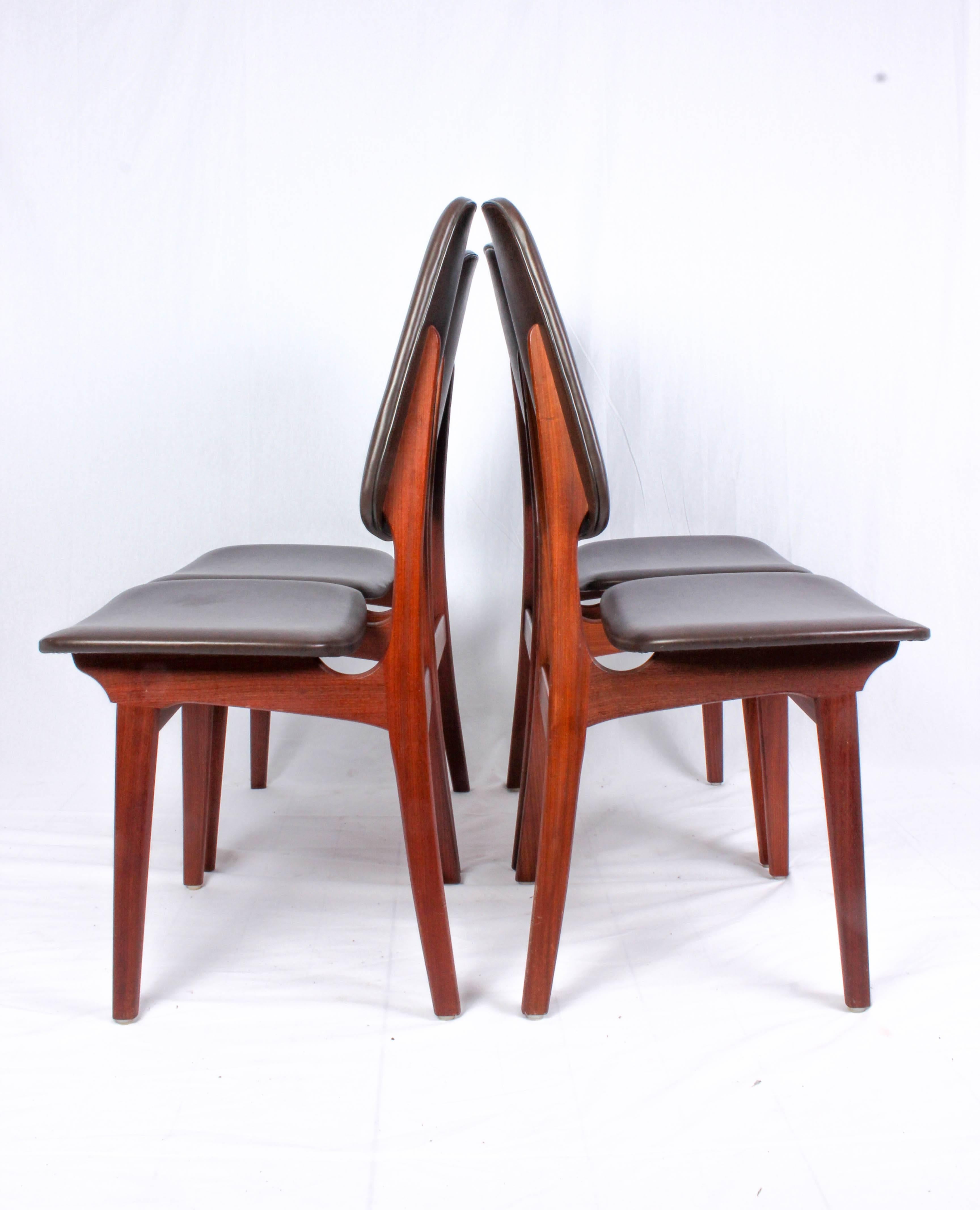 Set of four teak dining chairs with original brown faux-leather upholstery by Brødrene Sørheim. The chairs are in very good vintage condition with signs of usage consistent with age. There are som minor scuffs on the upholstery.
