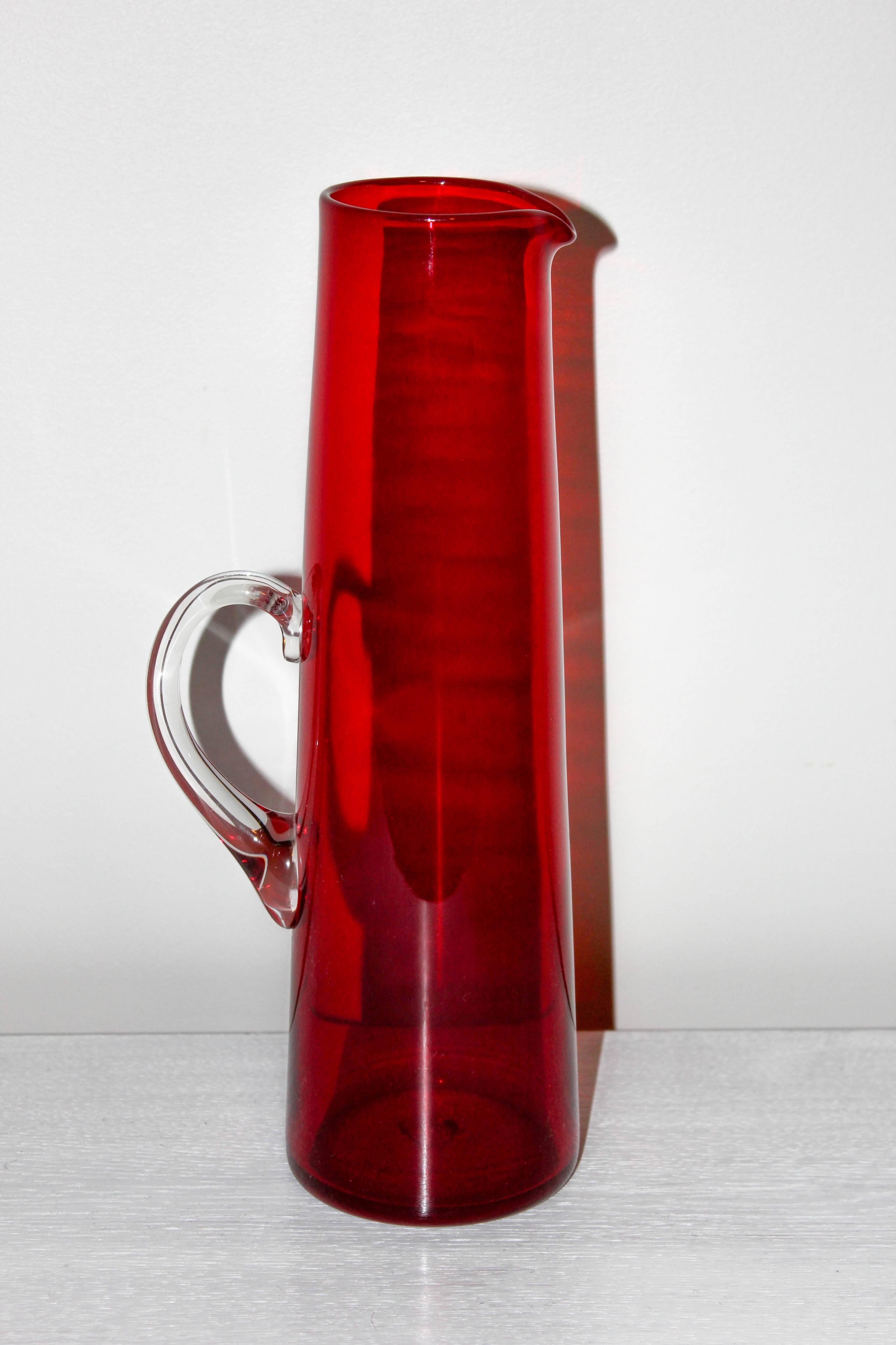 Midcentury Glass Jug designed by Monica Bratt and made out of red glass (with transparent handle) at Reijmyre Glasbruk. Excellent vintage condition. 