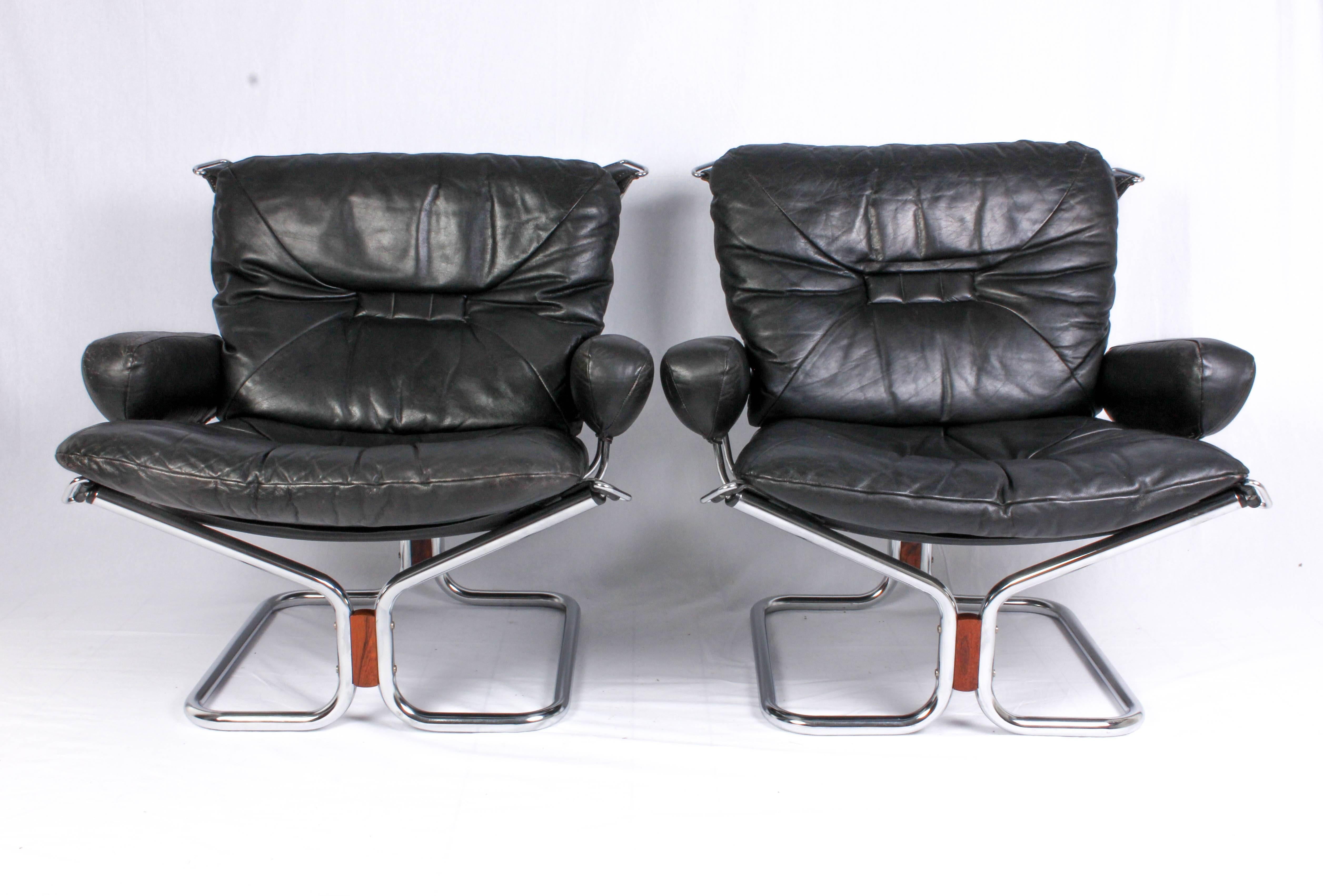 Scandinavian Modern Pair of Midcentury Leather & Chrome Lounge Chairs and Ottoman by Ingmar Relling
