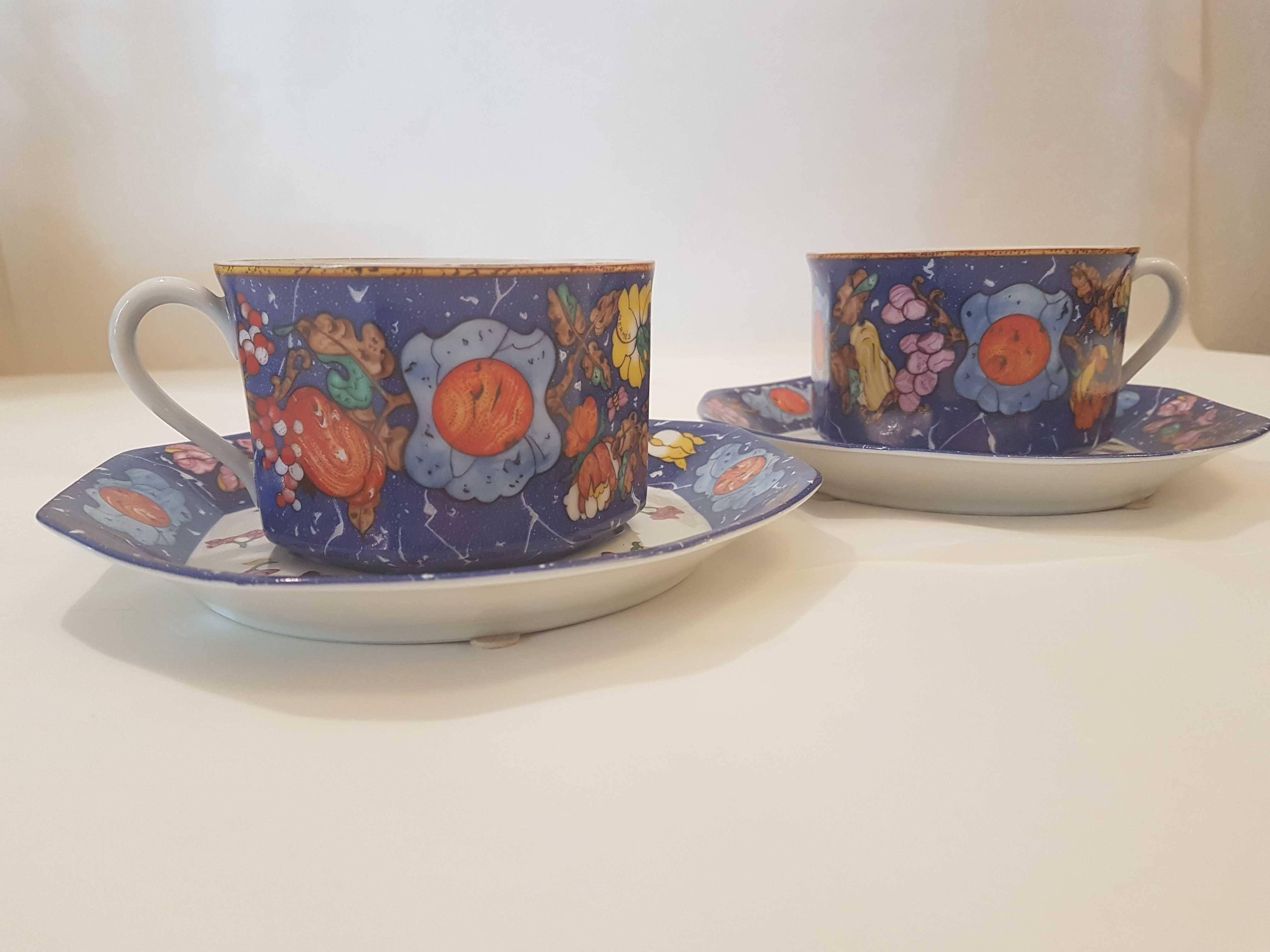 An Hermès polycrome porcelain breakfast set comprising two cups and two saucers.
Marqueterie de Pierre d'Orient et d'Occident pattern :this collection of porcelain was inspired by the art of marquetry as it was practiced with inlaid marble in 16th