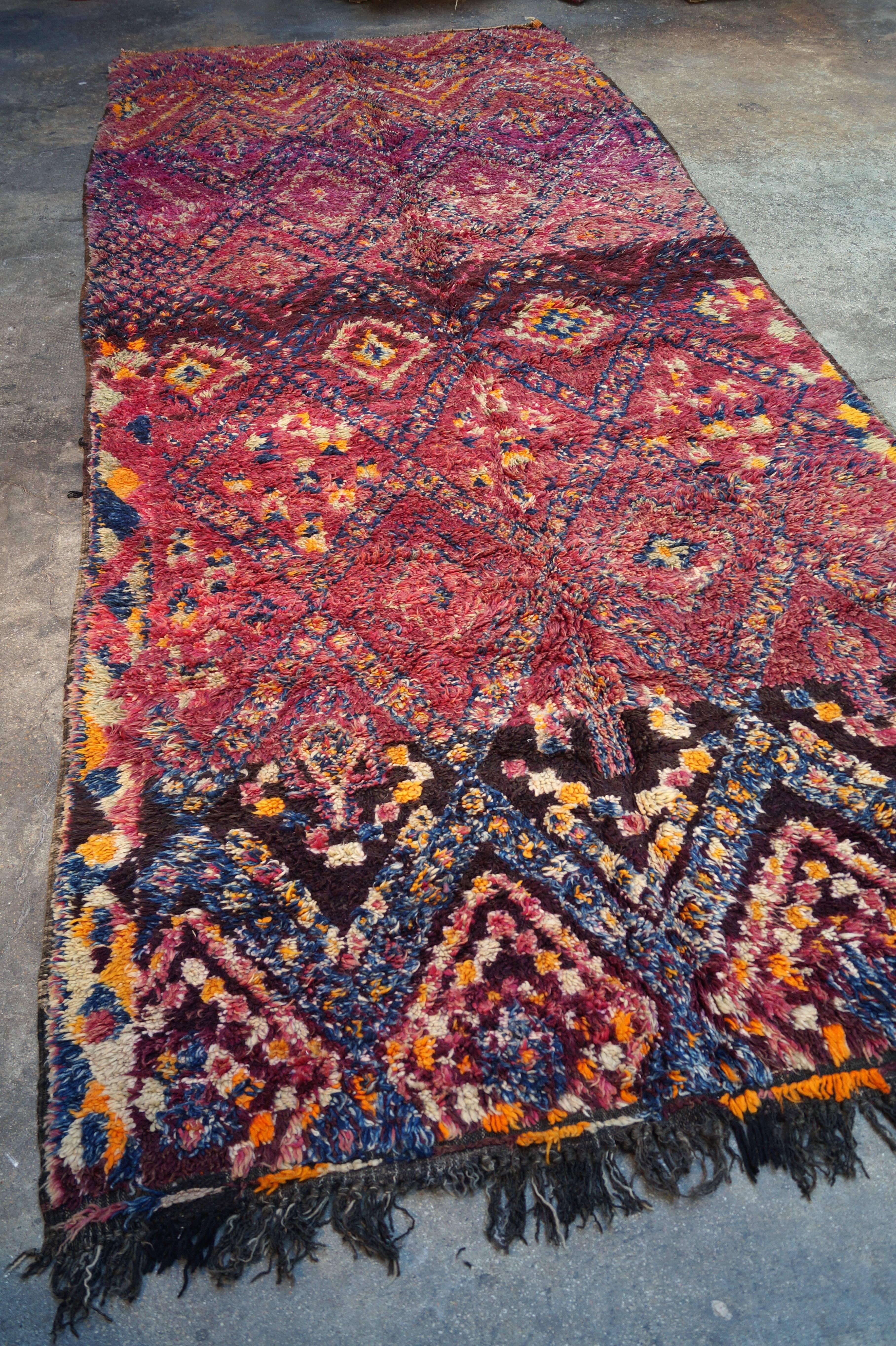 Vintage Moroccan rug 
Measures: 430 x 180 cm
Handmade in the Middle Atlas, Beni Mguild tribe
One of a kind, hand-knotted wool
1940s-1950s.