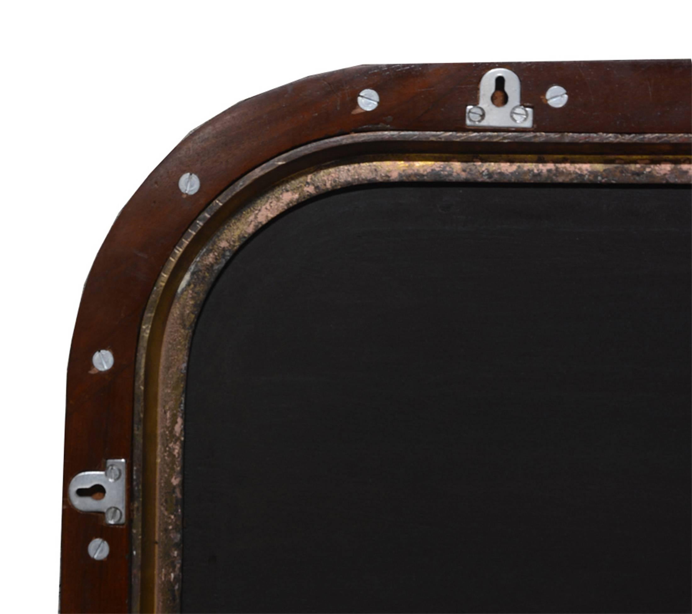 Original ship's brass porthole mirror, the holes are filled by blind bolts, fixing device on the back.

Measures: 67 x 57 cm / mirror 55 x 45 cm / depth 4.5 cm / 18.5 kg.