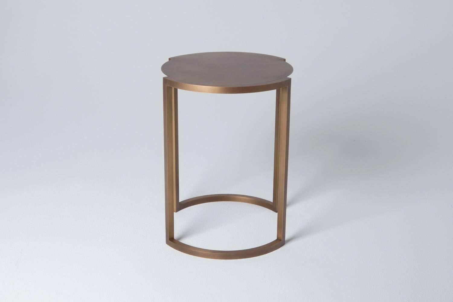 Solid arched brass legs outline the delicate aged brass top of the Covet end table, creating a balance of precision and elegance.

Also, available in Black Steel. Please inquire for additional information.

Designed and hand crafted  by Soraya