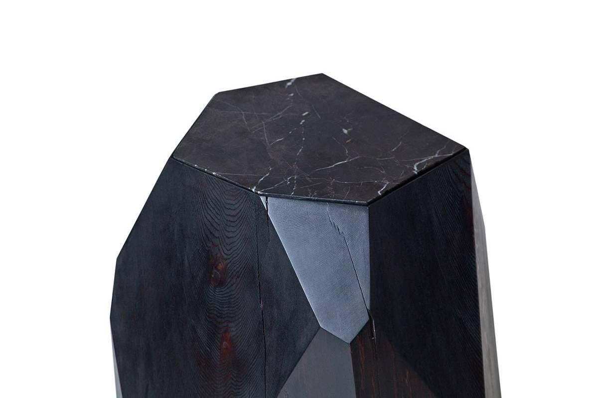 Cast-off cedar logs are given second life as a crystalline form. Named Little Gem, the natural beauty of reclaimed wood is harnessed in this side table and sculpture piece where nature informs design. Each Little Gem is hand-shaped and faceted based