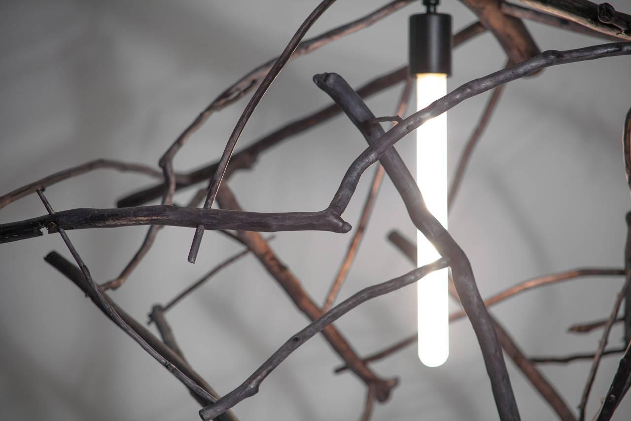 This pendant light gets its name from its materials: Scatter / Gather. Wooden branches scattered far and wide along the rugged Pacific shoreline are gathered up and then hand-constructed using pegged and glued through-tenons. No fasteners detract