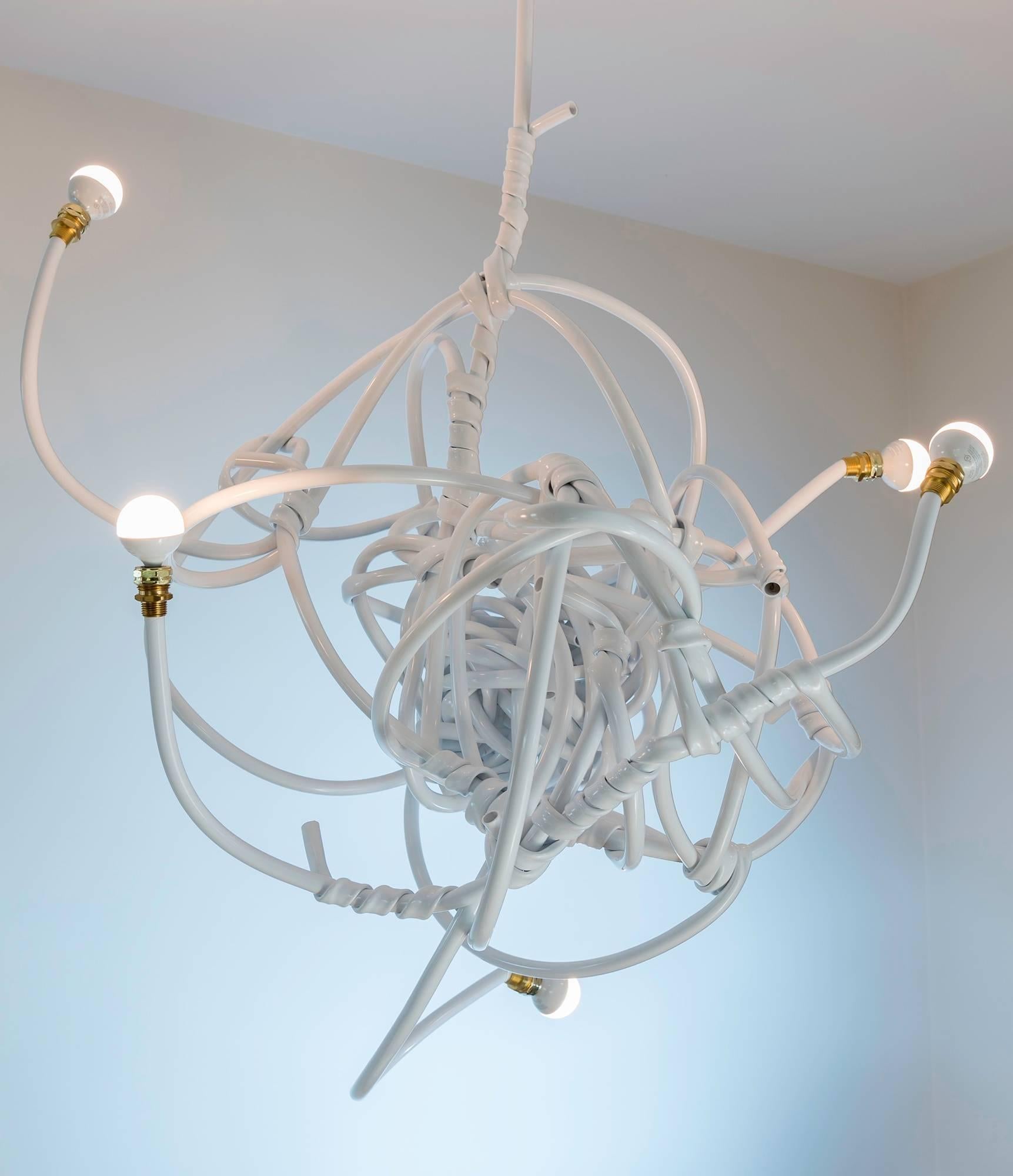 Contemporary and playful chandelier style lighting design created from vinyl hose to add subtle wit and a sculptural ambiance to your interiors. Easily installs directly into standard ceiling fixtures and uses 40w incandescent or 60w LED bulbs. This