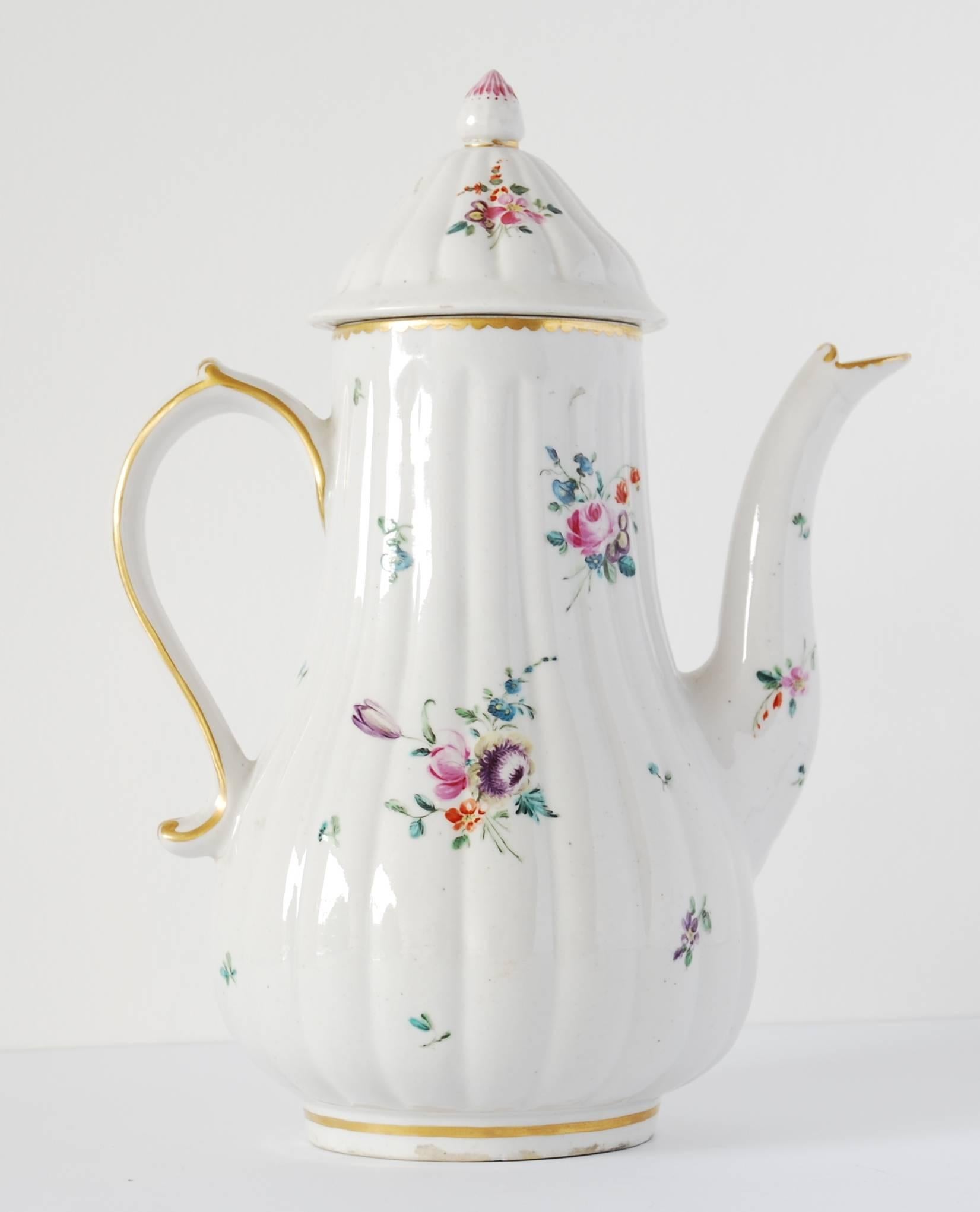 A gadrooned, pear-shaped coffee pot, decorated with formal sprays of flowers in the manner of Edward Withers.