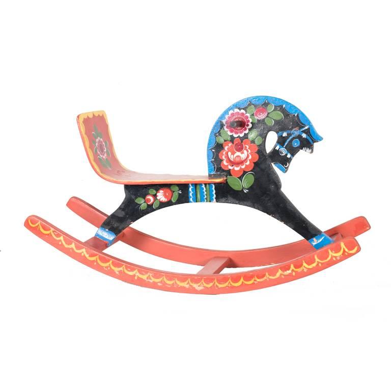 Very decorative midcentury Russian Rocking horse's.
These wooden rocking horses are all hand-painted and not one is the same.
These pair of kids toys are a beautiful statement pieces especially at the holidays. 

 