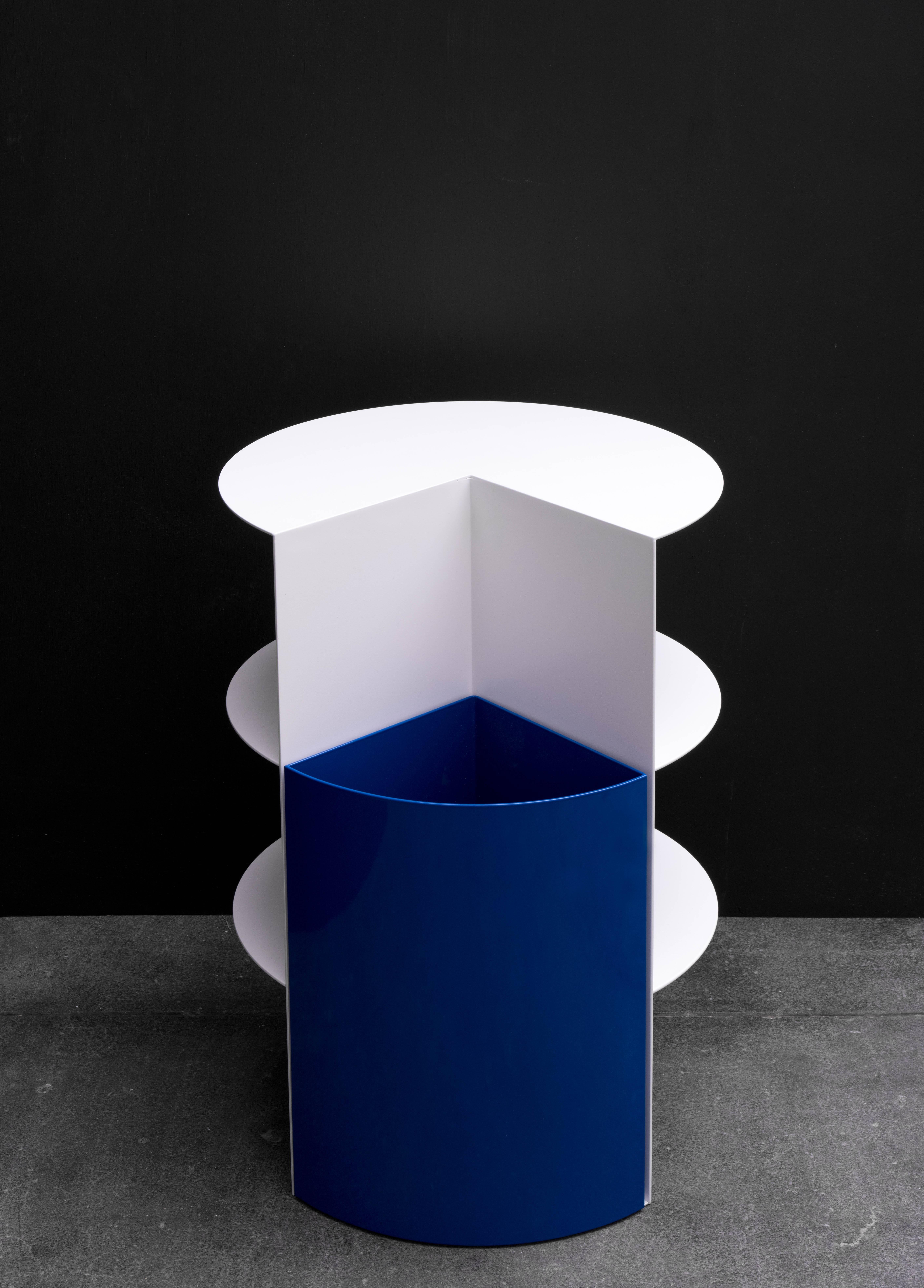 Stark and bold geometric distinctions give the piece a striking silhouette. This design has two elements - a planter bin and cantilevered shelving. The planter, once filled with soil, provides the counterweight to the shelves. This dramatic