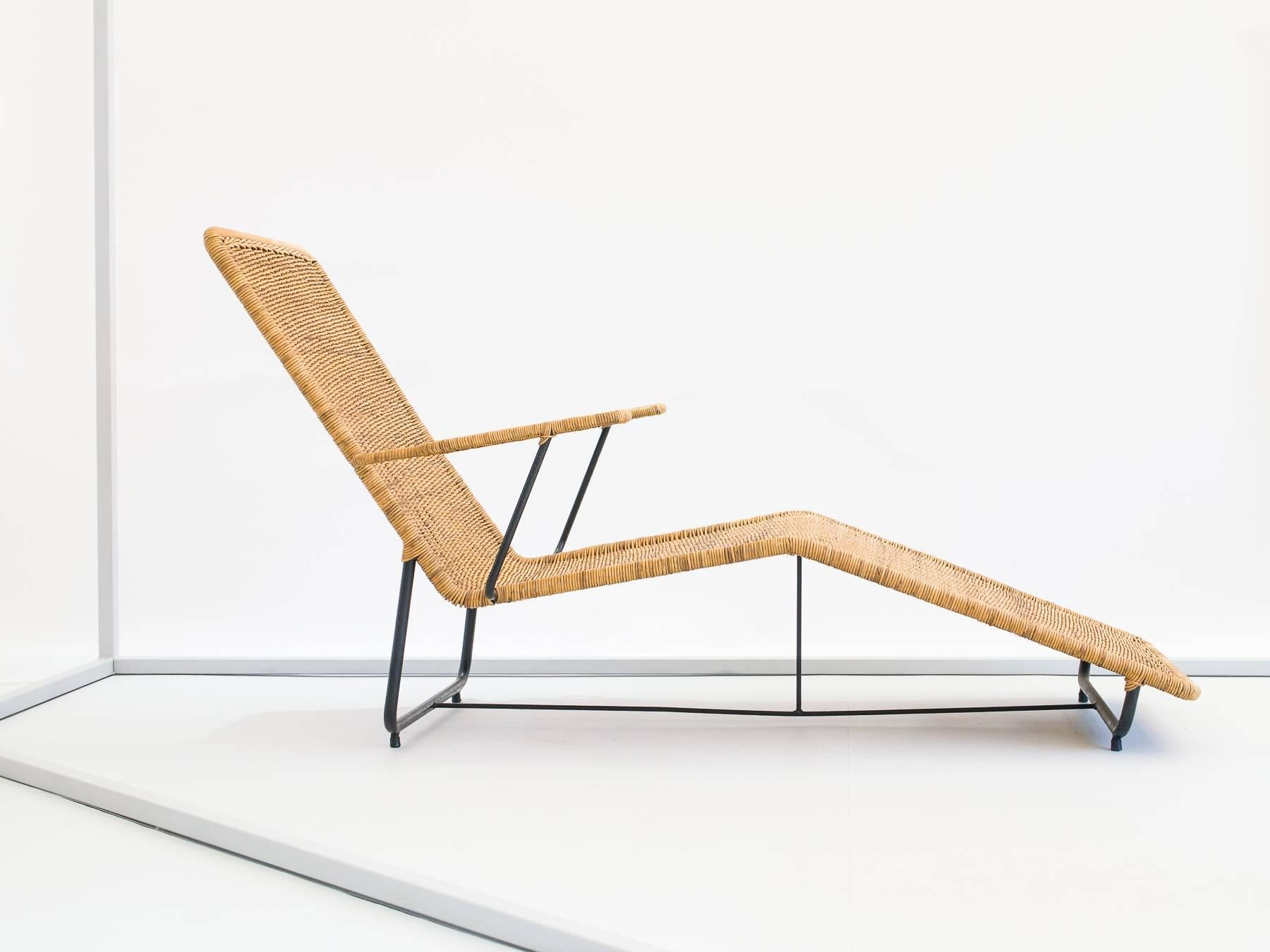 Great angles on this comfortable chaise made of iron and reed.