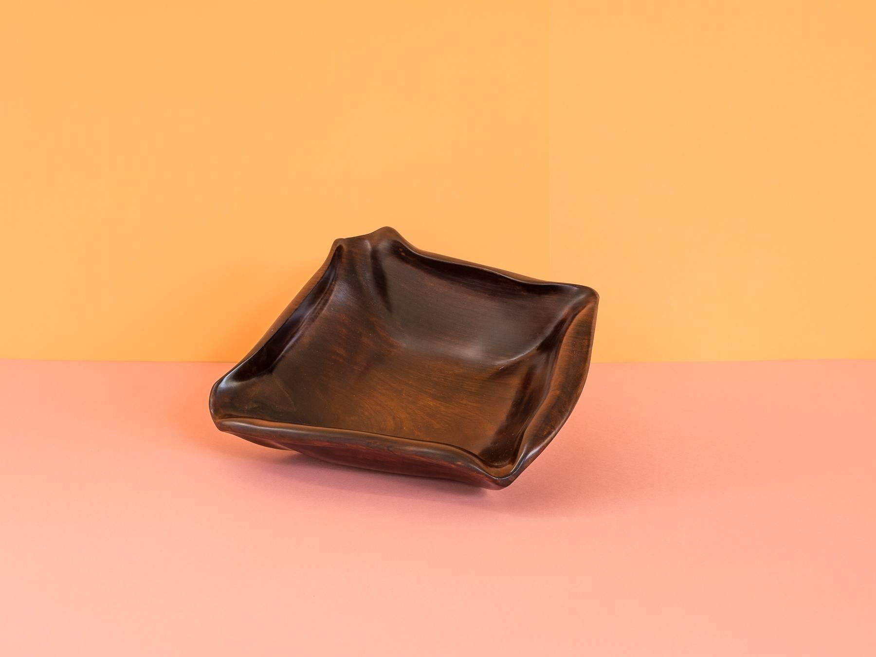 This amazing solid rosewood bowl was designed by Romanian born Jean Gillon, for his company Wood Art in the late 1960s. The piece has been restored and refinished.