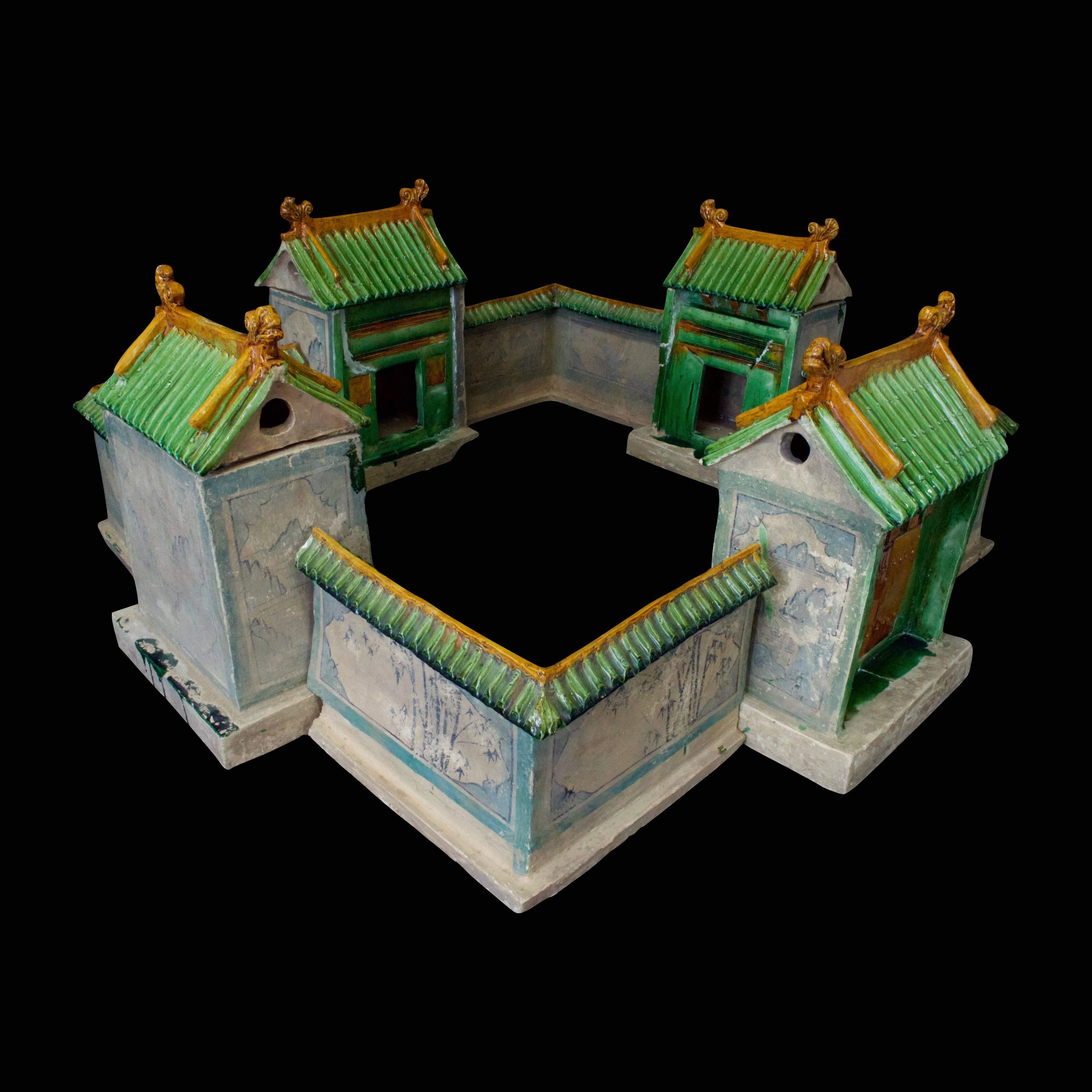 Extremely rare Chinese model of a countryside villa for the royal courtiers and ministries of the Ming Dynasty -1368-1644 AD- showing three guest houses and one main entry. The villa is surrounded by a cuadrangular wall painted with bucolic scenes
