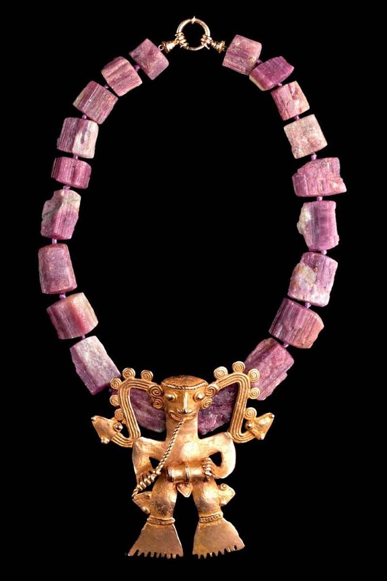 Natural pink tourmaline necklace (167 gms) with rare gold Veraguas/Diquis supernatural drummer. Very fine example of ancient, Precolumbian goldwork form Central America, either Costa Rica or Panama. 111 grams of blush pink gold made with “lost wax”