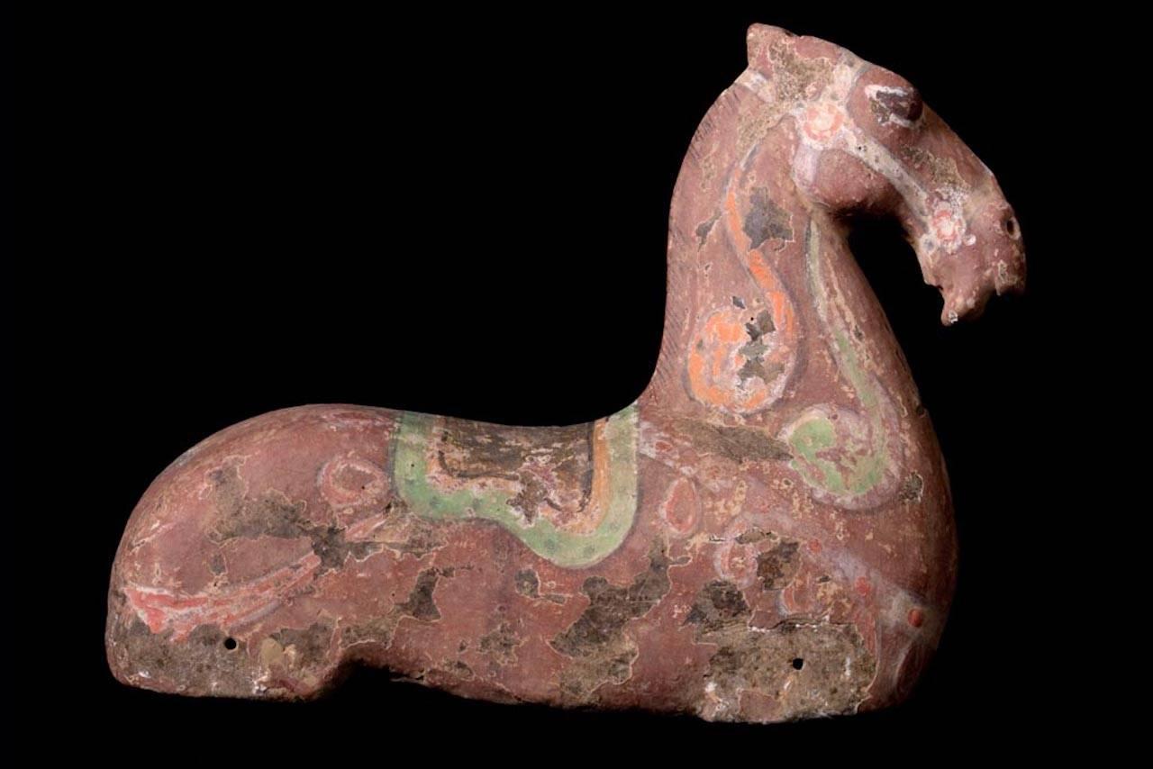 Elegant Han Dynasty Grey Terracotta Horse With Polychrome Traces of the Original Painting. This beautiful figure would originally have had wooden legs and ears, which have long since decomposed. The body is strong and powerful with sensuous curves,