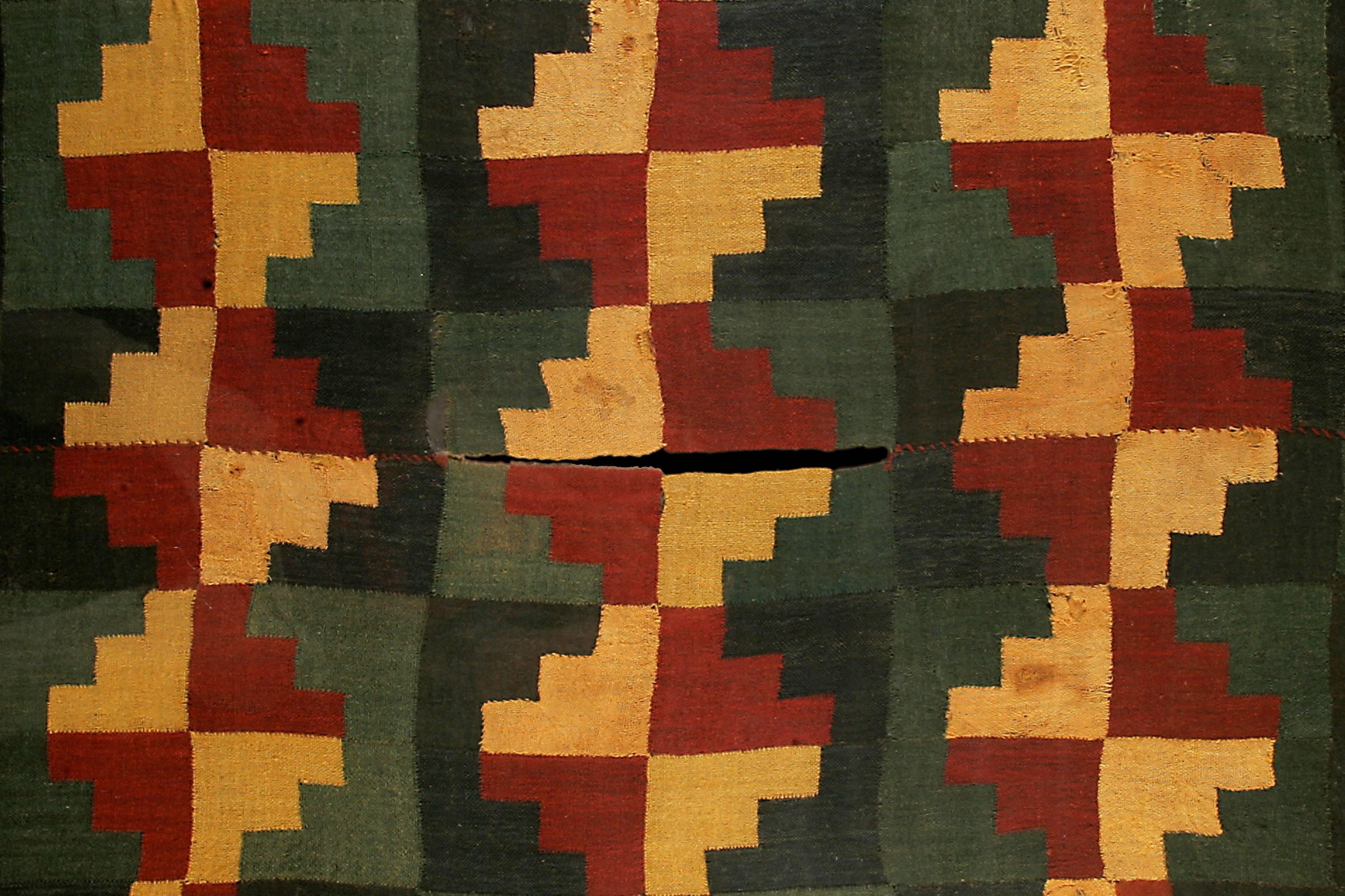 Impressive Nazca Cushma of checker works design composed of a red and yellow cross over the green background. A true collector's piece. 


Provenance: From the Collection of Guillot Munoz

Additional documentation accompanying the piece: 
-