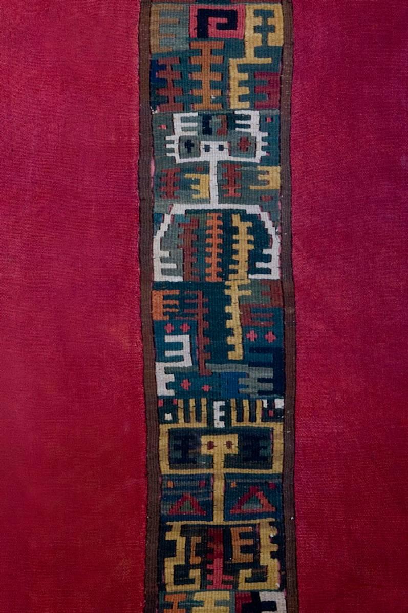 Beautiful Pre-columbian Mantle with a Central Kilim Type Tapisserie of Multicolor Designs with Priests Upraising their Arms Toward the Skies. It is surrounded by 2 Long Red Plain Cotton Bands. A true collector's piece. 

Provenance: From the