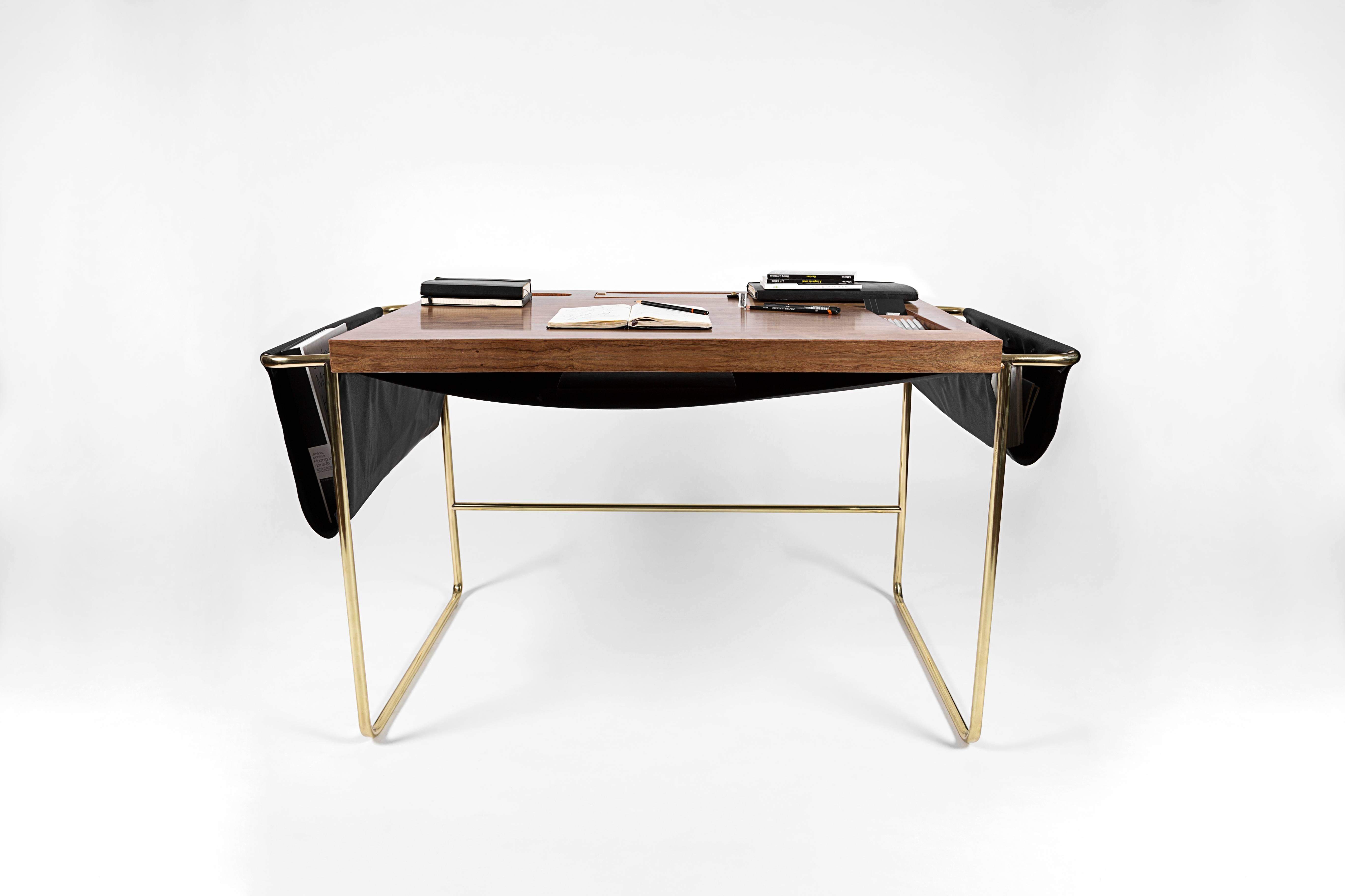 A striking balance between sharp edges and soft leather pocketing is found in the Casablanca desk by contemporary Nomade Atelier ´s Mexican design. Secret compartments for storing small treasures and chords. Walnut hardwood handcrafted tabletop,