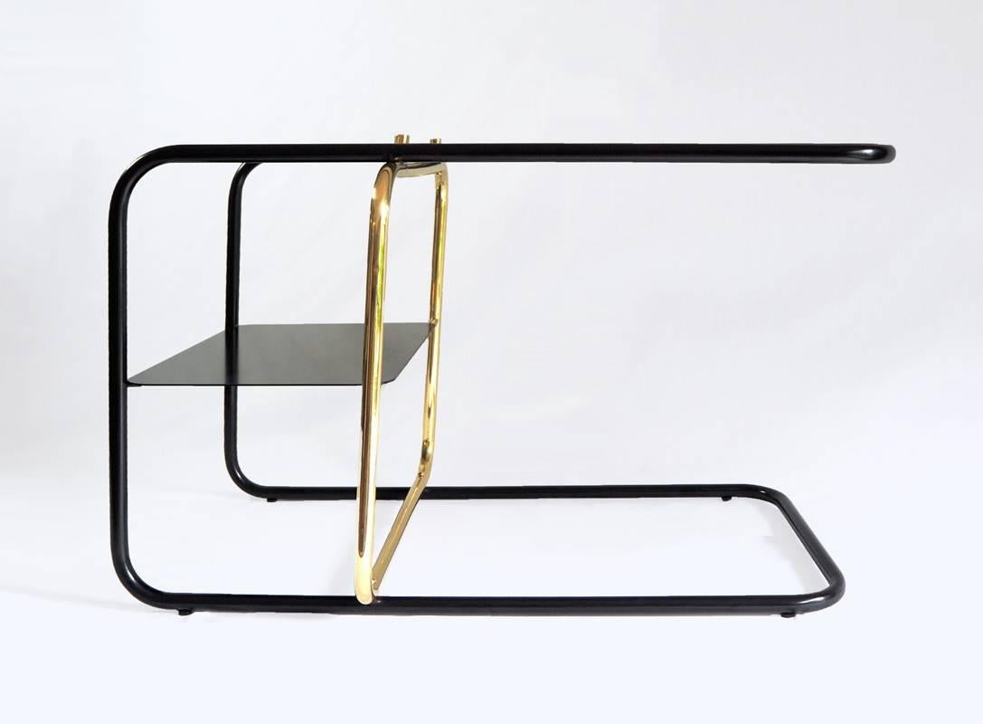 Inspired by the Bauhaus era masterful craft, Mexican Design firm Nomade Atelier has created the Lateral side table is an ode to geometric balance, tubular shapes and paramount functionality. Golden and black brass strike a timeless contrast against